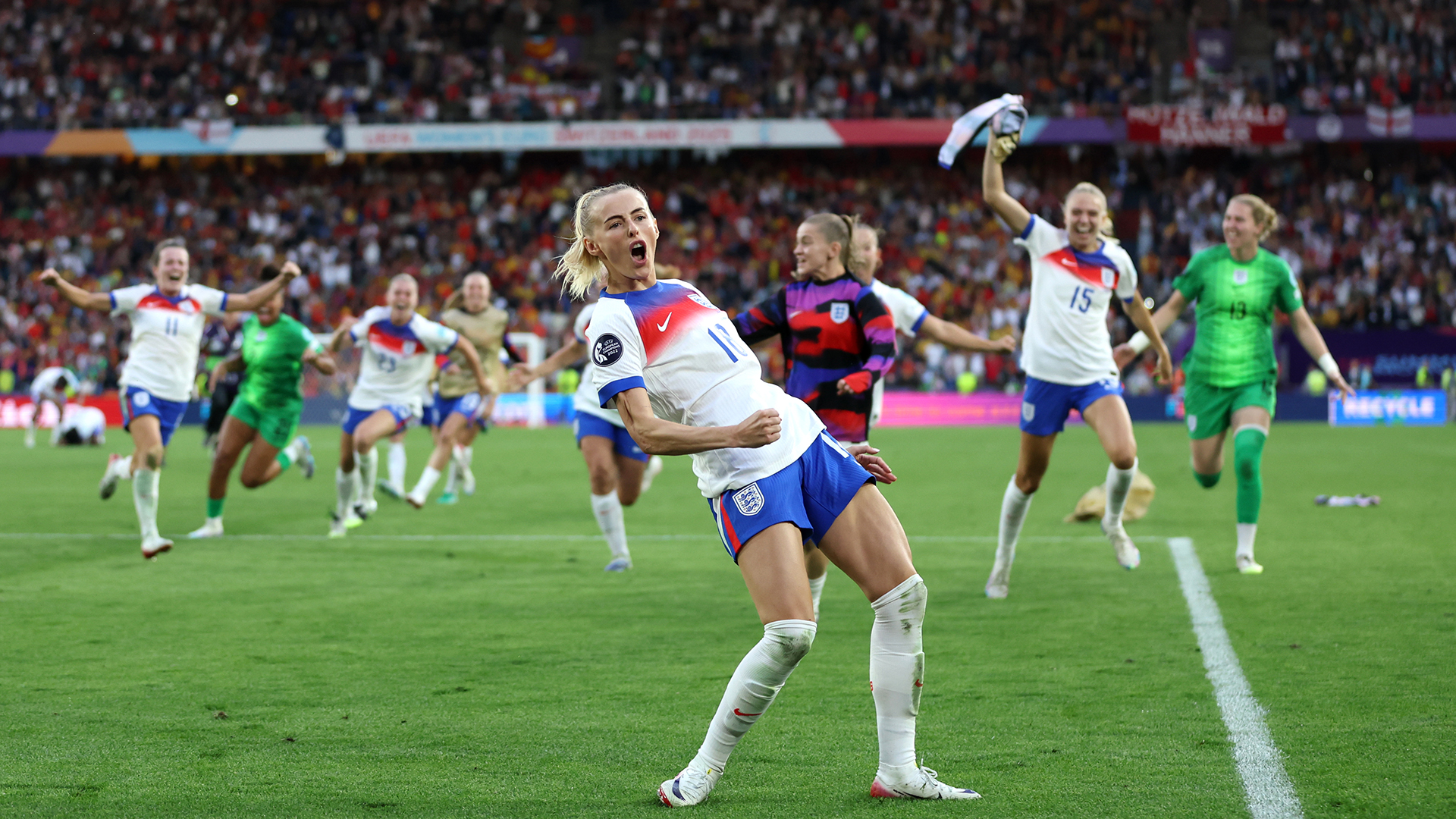 Chloe Kelly of England celebrates after scoring the team's winning penalty in the penalty shoot out during the UEFA Women's EURO 2025 Final match between England and Spain at St. Jakob-Park on July 27, 2025 in Basel, Switzerland.
