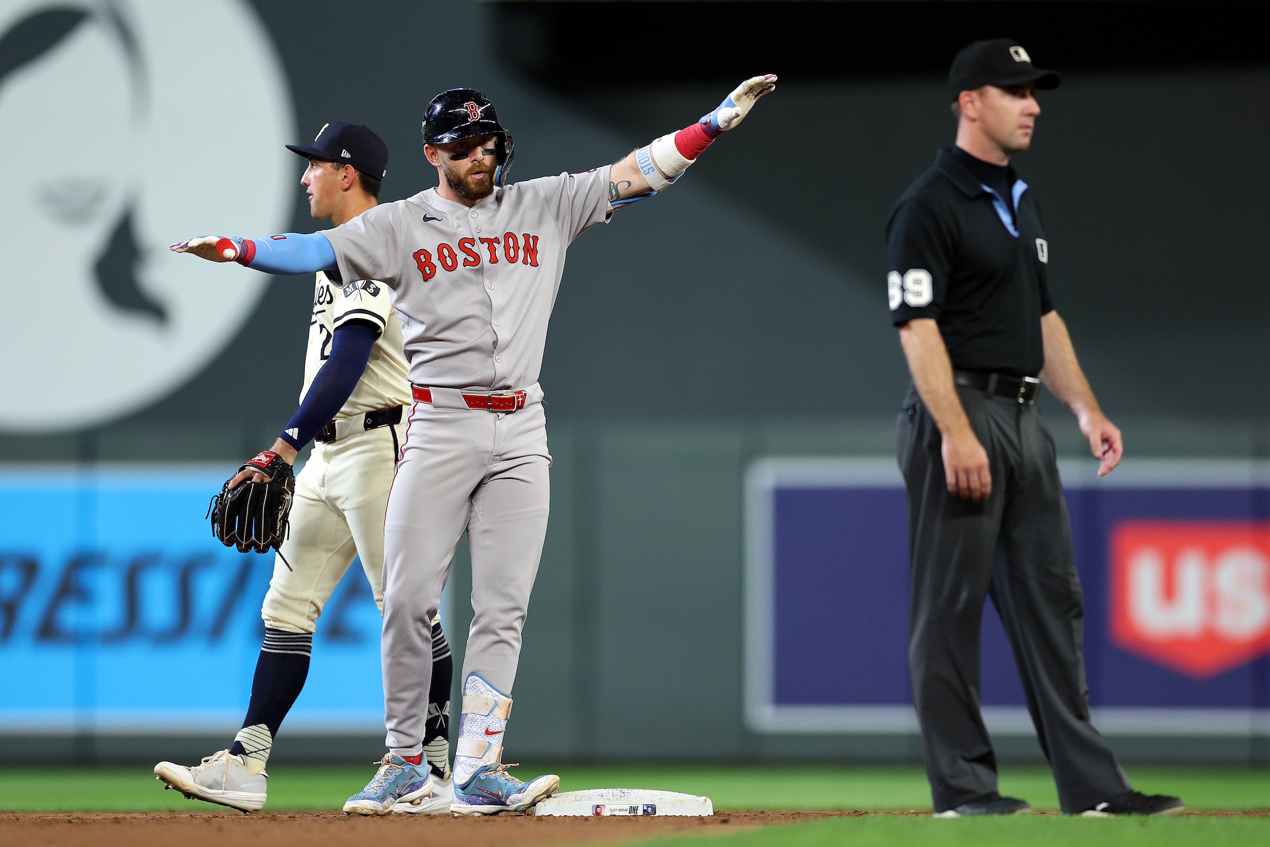 Trevor Story does the airplane celebration.