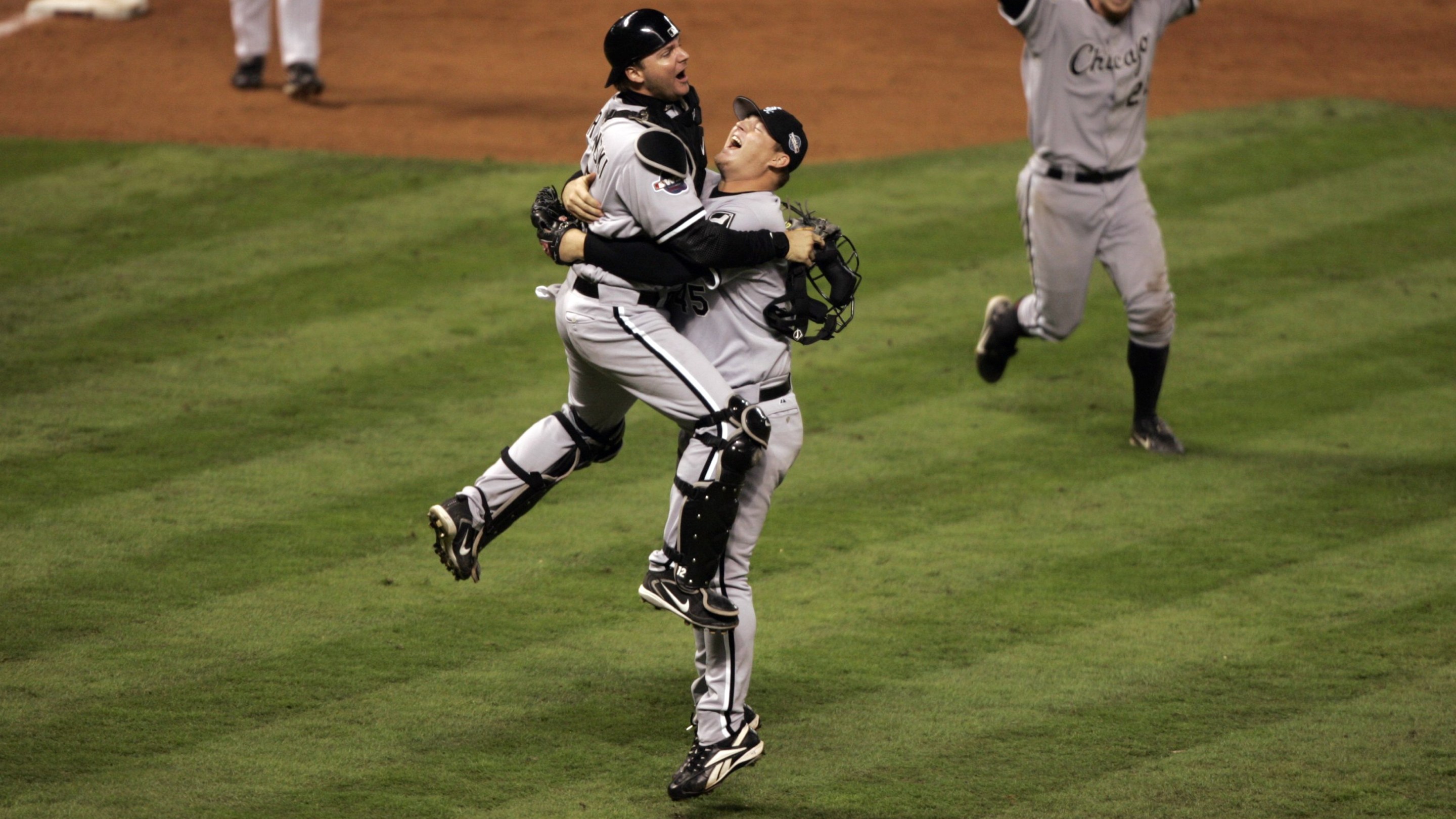 UNITED STATES - OCTOBER 26: Baseball: World Series, Chicago White Sox A,J, Pierzynski (12) and Bobby Jenks (45) victorious after winning Game 4 and series vs Houston Astros, Houston, TX 10/26/2005 (Photo by John Biever/Sports Illustrated via Getty Images) (SetNumber: X74496 TK4)