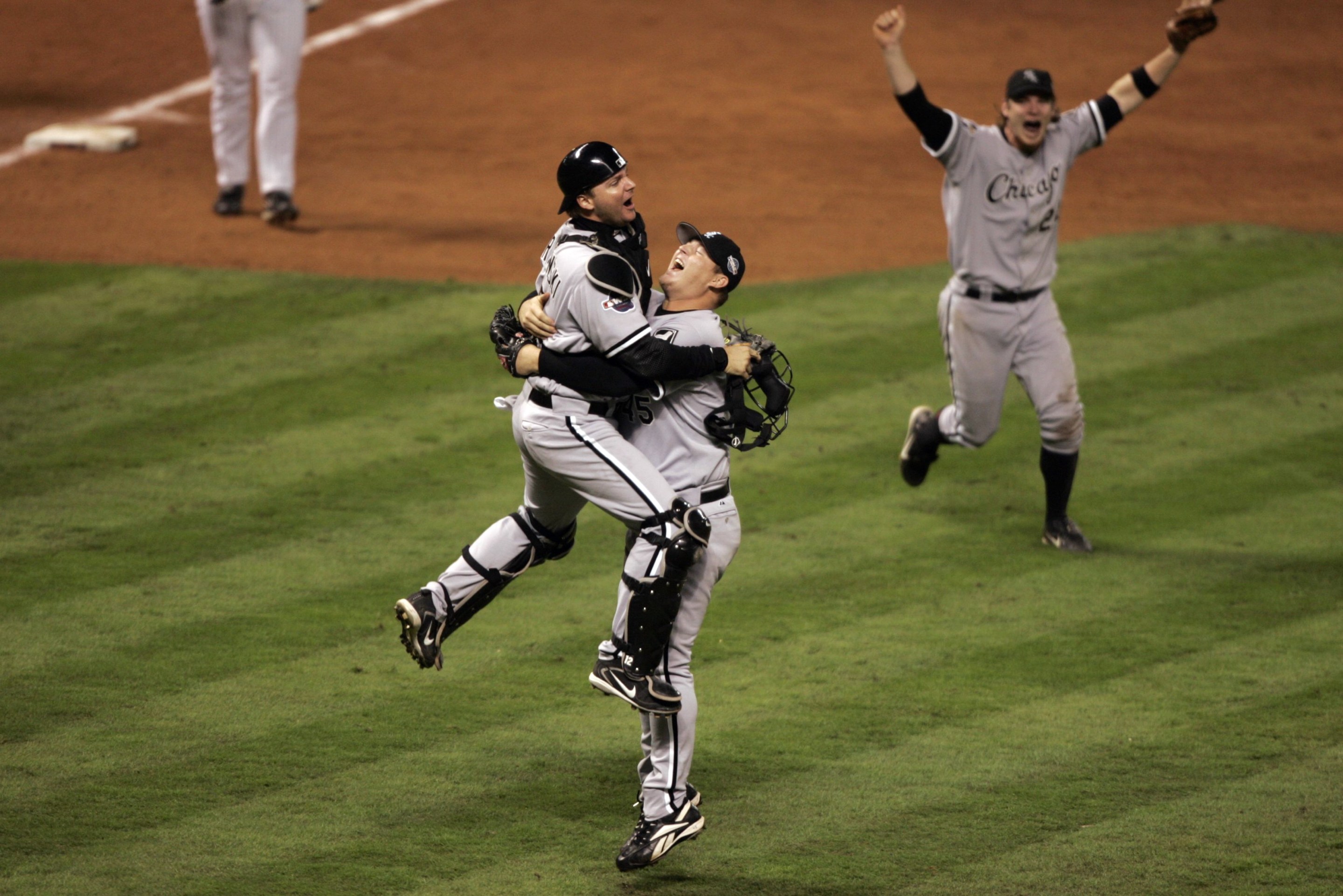 UNITED STATES - OCTOBER 26: Baseball: World Series, Chicago White Sox A,J, Pierzynski (12) and Bobby Jenks (45) victorious after winning Game 4 and series vs Houston Astros, Houston, TX 10/26/2005 (Photo by John Biever/Sports Illustrated via Getty Images) (SetNumber: X74496 TK4)