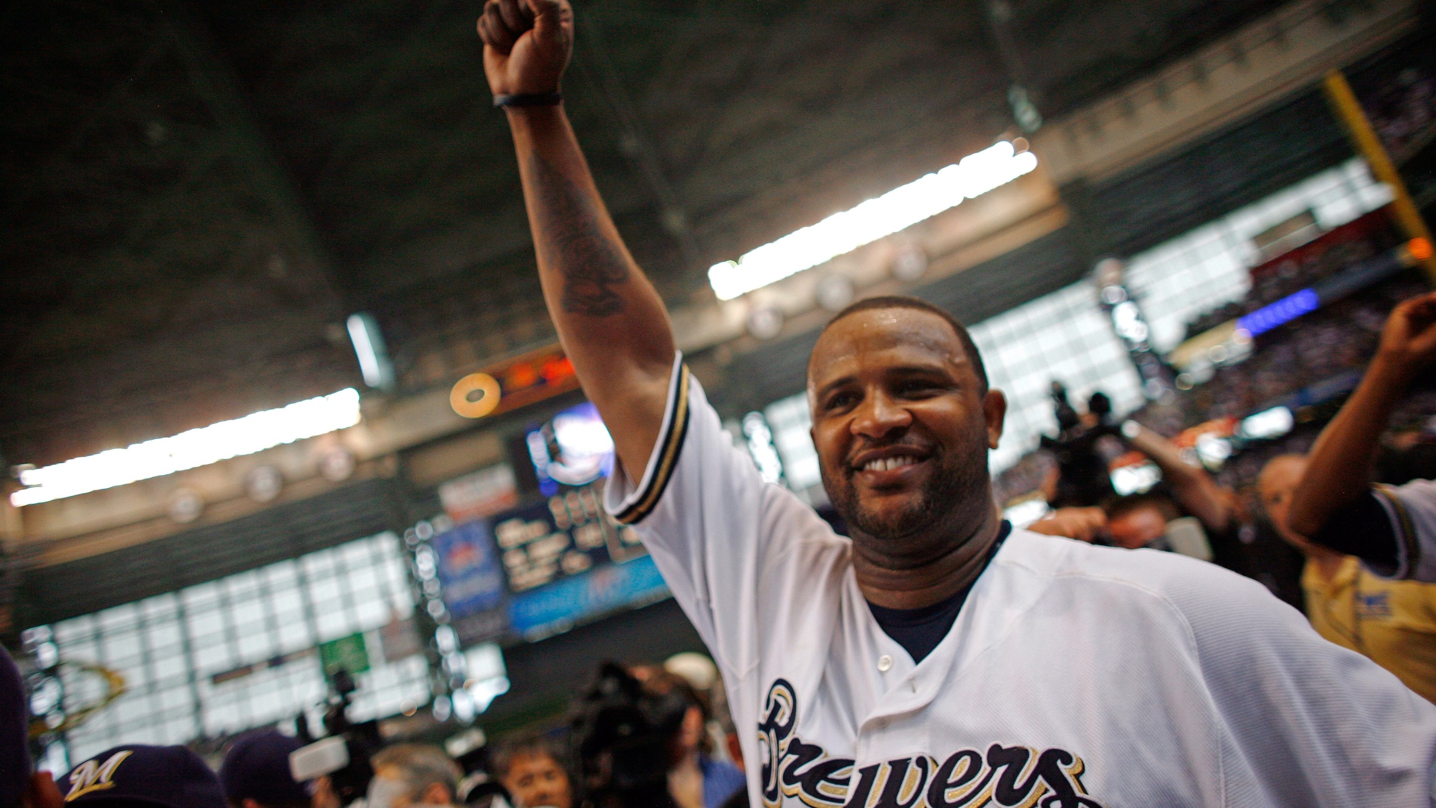 MILWAUKEE - SEPTEMBER 28: Starting pitcher of the Milwaukee Brewers CC Sabathia pumps his fist after pitching a complete game as they celebrate clinching the National League Wild Card after the game against the Chicago Cubs at Miller Park on September 28, 2008 in Milwaukee, Wisconsin. The Brewers defeated the Cubs 3-1. (Photo by Darren Hauck/Getty Images)