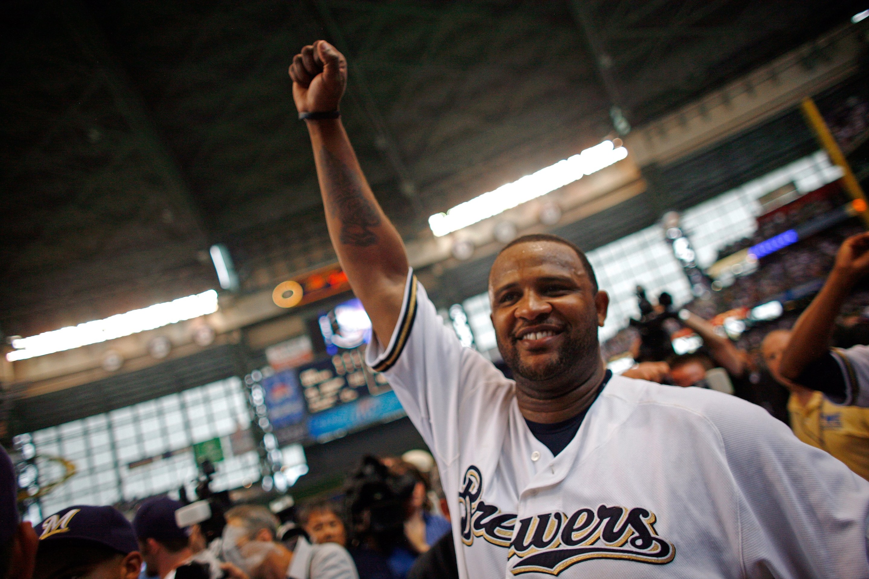 MILWAUKEE - SEPTEMBER 28: Starting pitcher of the Milwaukee Brewers CC Sabathia pumps his fist after pitching a complete game as they celebrate clinching the National League Wild Card after the game against the Chicago Cubs at Miller Park on September 28, 2008 in Milwaukee, Wisconsin. The Brewers defeated the Cubs 3-1. (Photo by Darren Hauck/Getty Images)