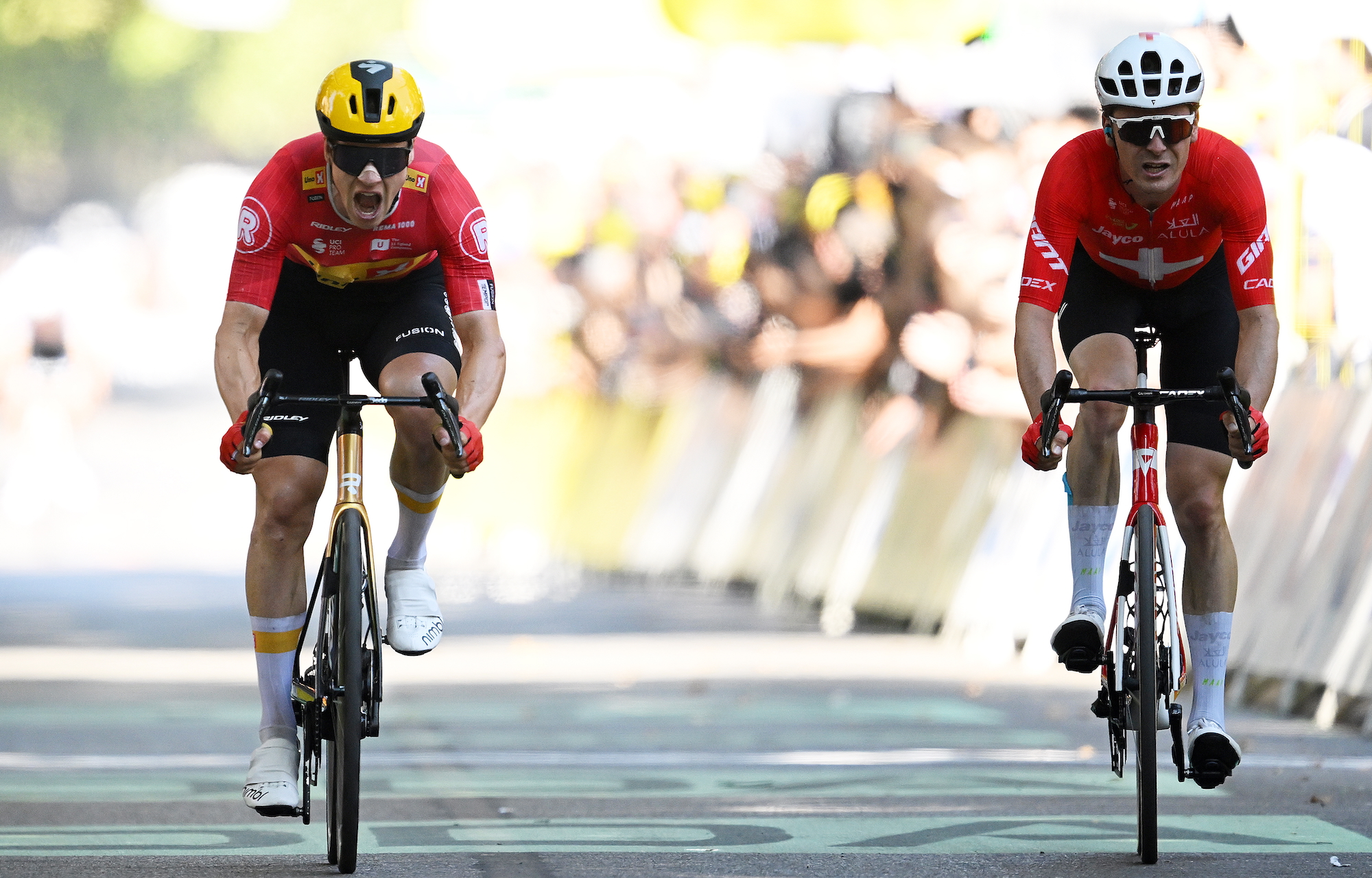 Stage winner Jonas Abrahamsen of Norway and Team Uno-X Mobility and Mauro Schmid of Switzerland and Team Jayco AlUla sprint at finish line during the 112th Tour de France 2025, Stage 11 a 156.8km stage from Toulouse to Toulouse