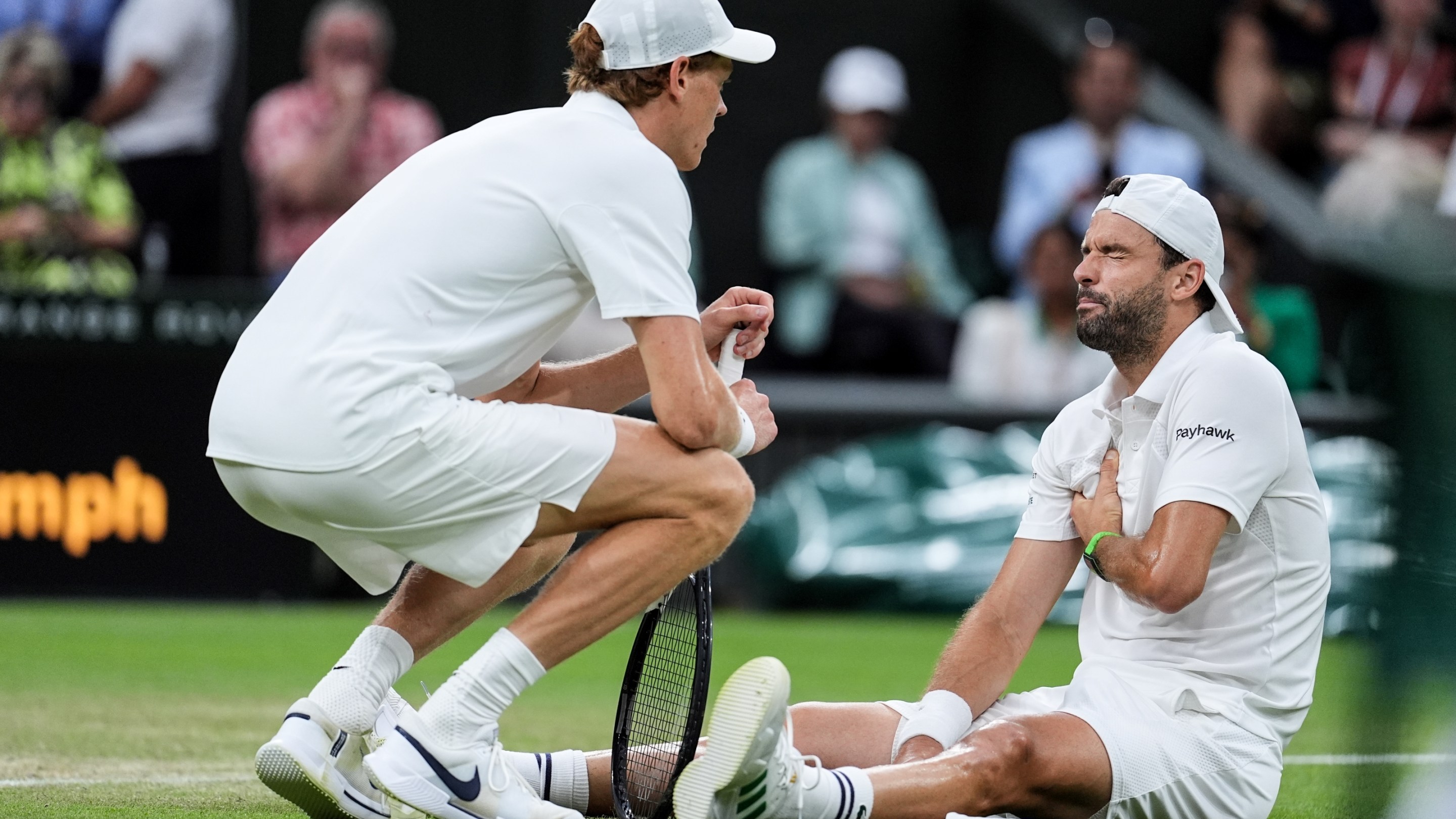 Grigor Dimitrov of Bulgaria gets an injury in the Gentlemen's Singles Fourth Round match against Jannik Sinner of Italy on day eight of The Championships Wimbledon 2025 at All England Lawn Tennis and Croquet Club on July 07, 2025 in London, England.