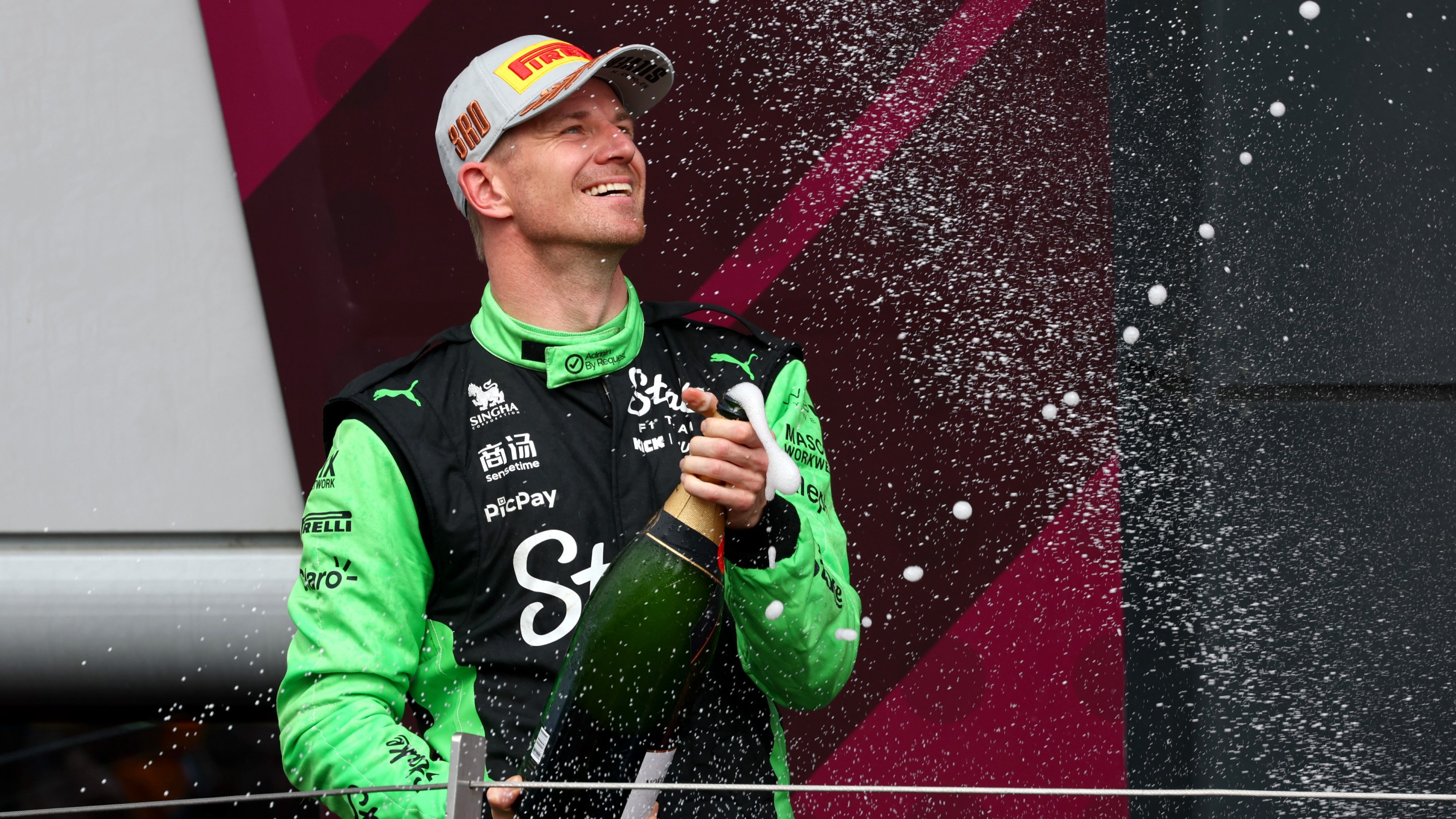 Third placed Nico Hulkenberg of Germany and Stake F1 Team Kick Sauber sprays Champagne on the podium during the F1 Grand Prix of Great Britain.