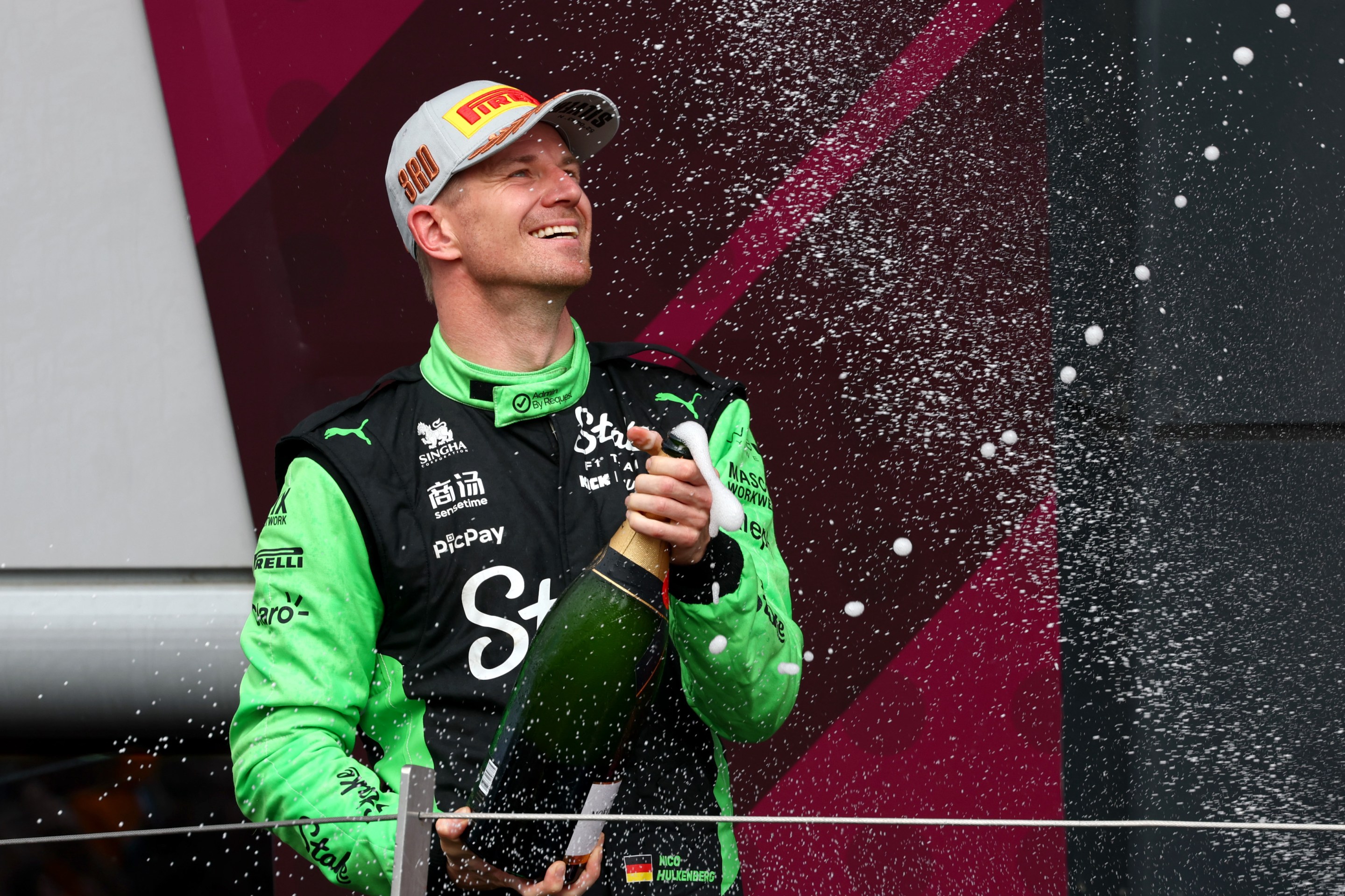 Third placed Nico Hulkenberg of Germany and Stake F1 Team Kick Sauber sprays Champagne on the podium during the F1 Grand Prix of Great Britain.