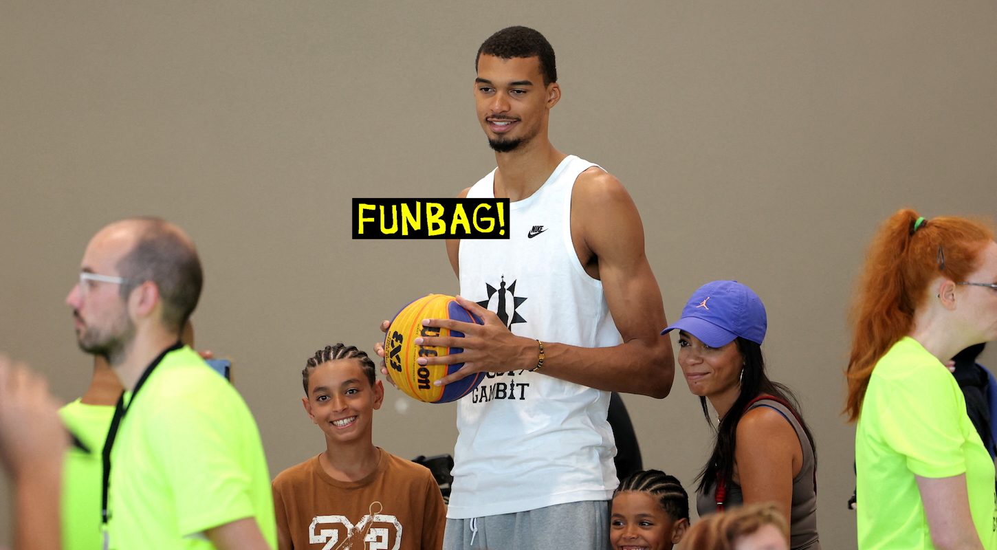 San Antonio Spurs French forward-centre Victor Wembanyama (C) reacts as he attends his event named "Hoop Gambit", a chess and basketball tournament that takes place in his birth town of Le Chesnay, south-west of Paris, on July 20, 2025.