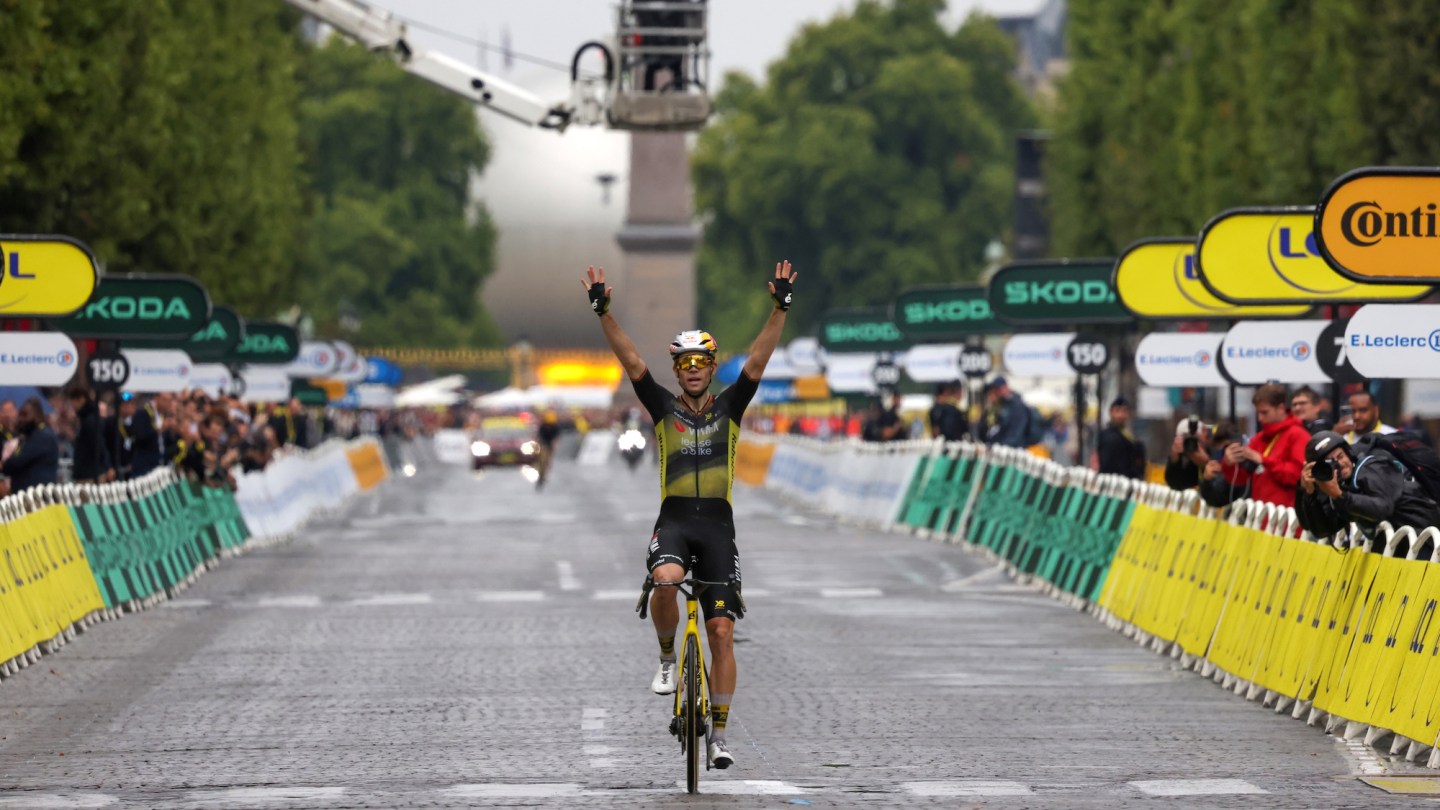 Wout Van Aert of Belgium and Team Visma | Lease a Bike celebrates at finish line as stage winner during Tour de France Stage 21, last and final stage of the 112th Tour de France.