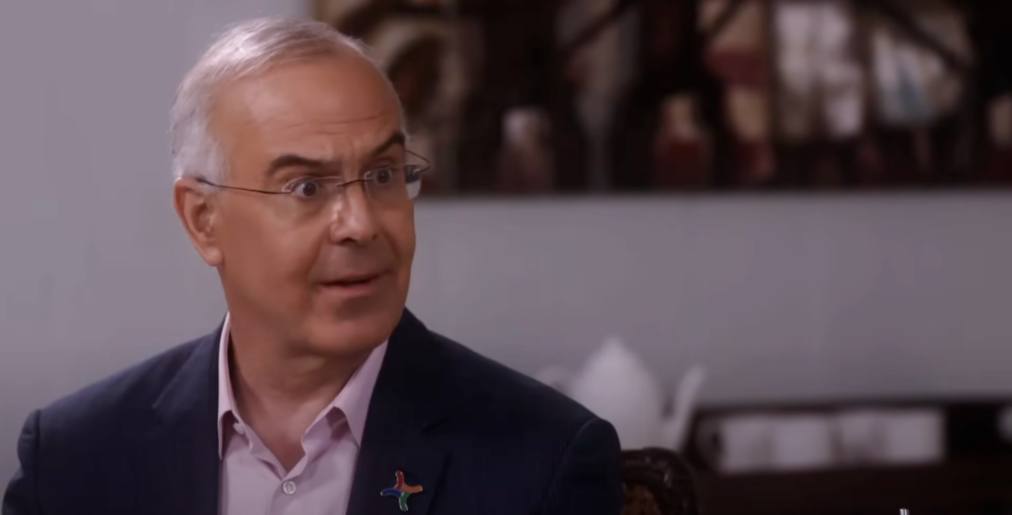 David Brooks making a surprised face while being interviewed by Oprah Winfrey on the OWN Netwrok.