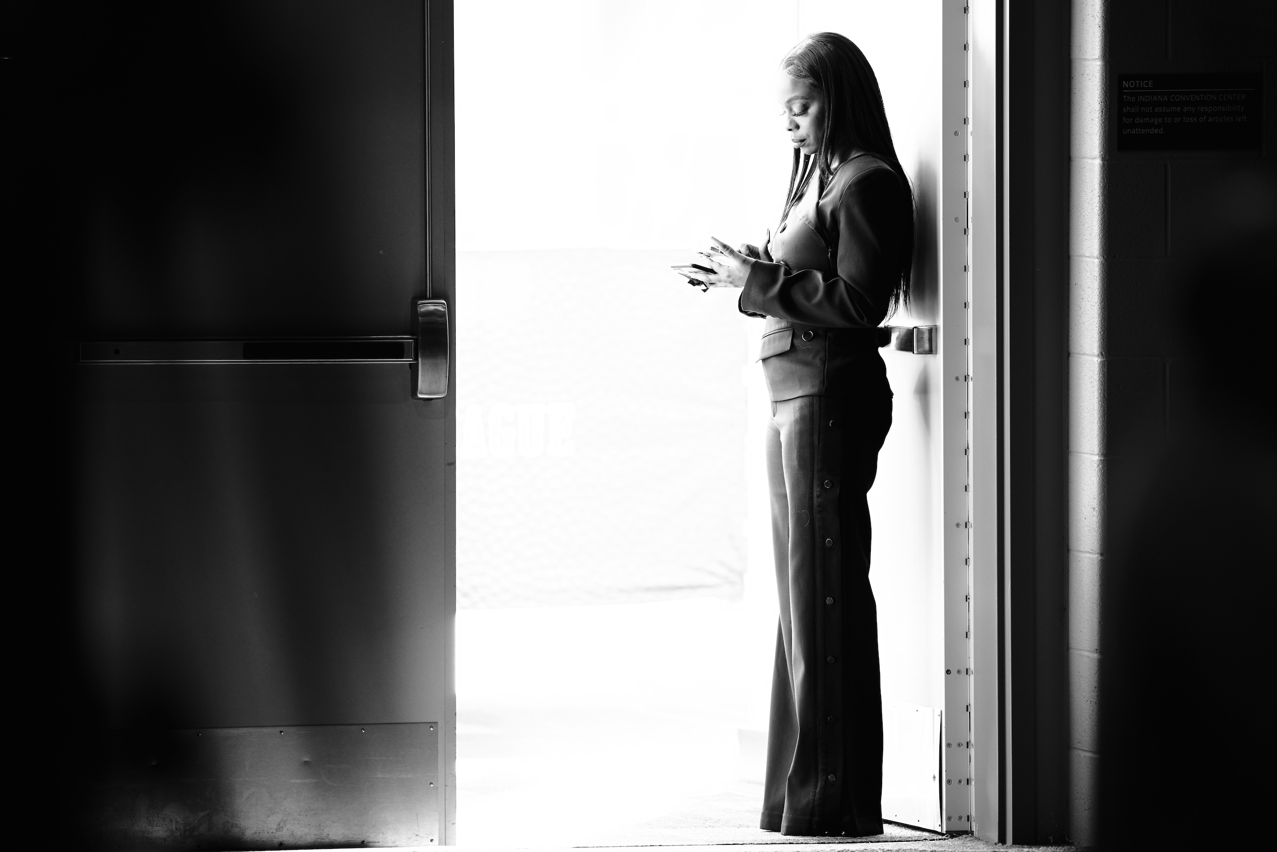 Josina Anderson stands in a doorway.
