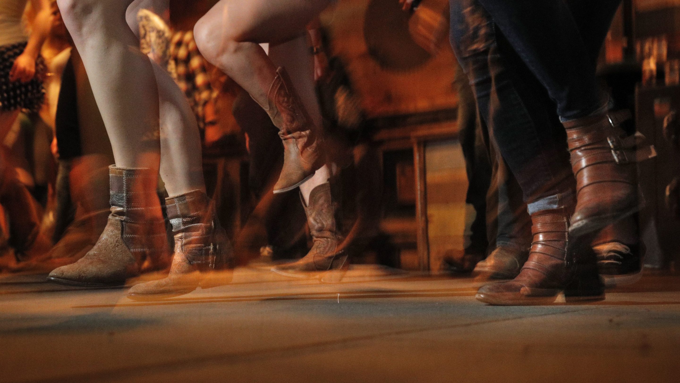 Patrons dance during weekly line dancing lessons