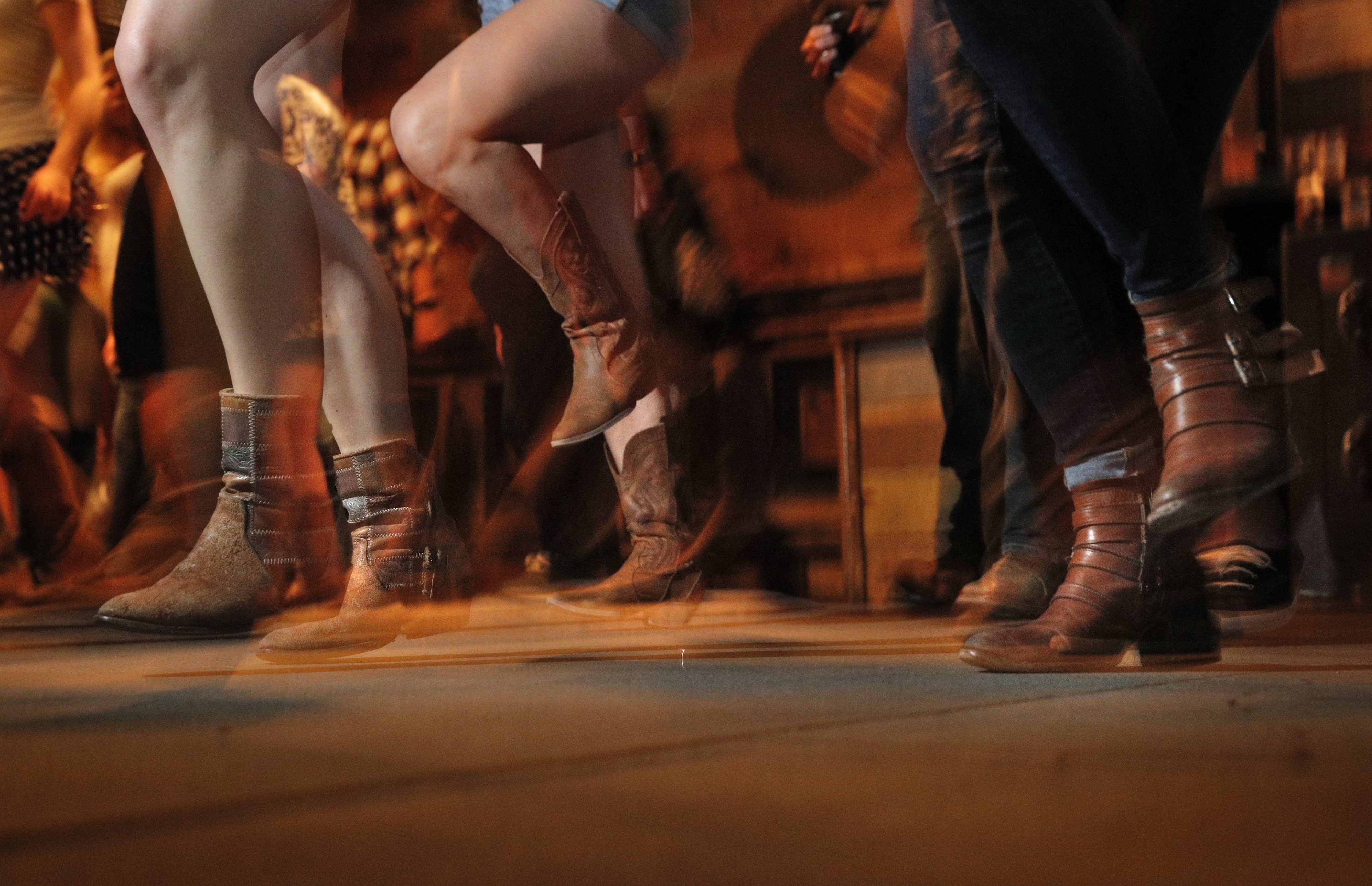 Patrons dance during weekly line dancing lessons