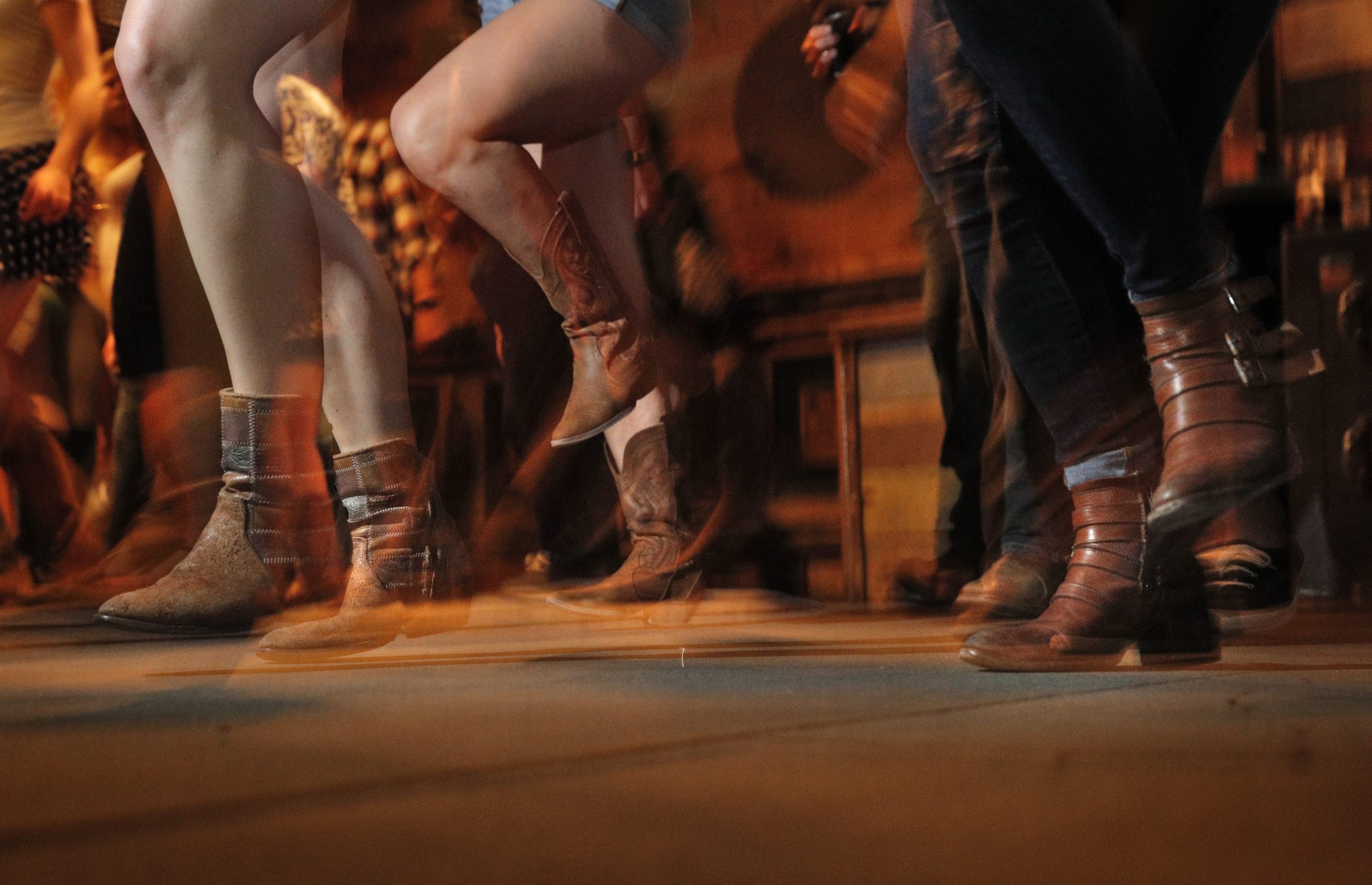 Patrons dance during weekly line dancing lessons