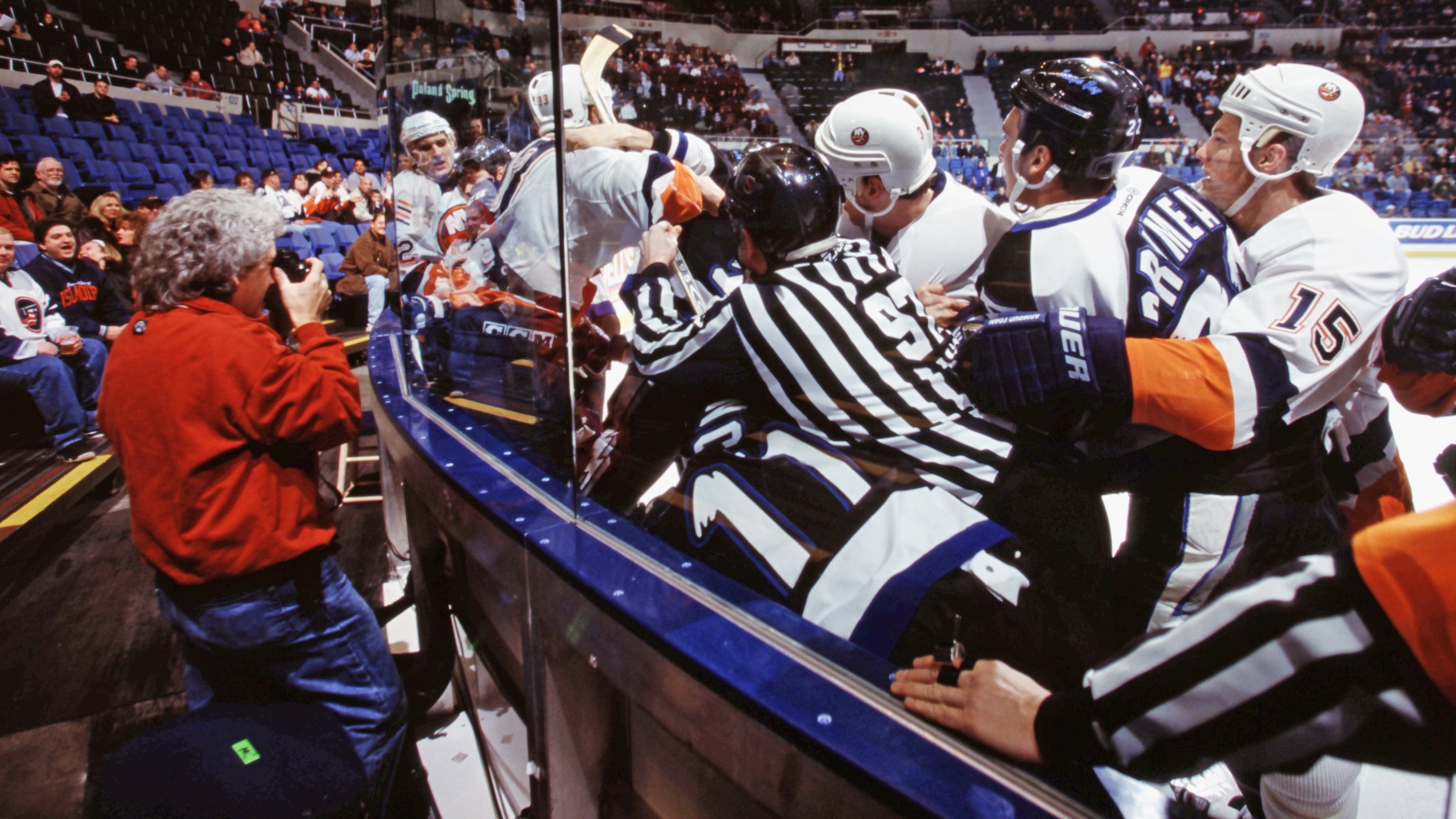 UNIONDALE, NEW YORK - CIRCA 2000: Photographer Bruce Bennett photographers a battle between the Tampa Bay Lightning and the of the New York Islanders circa 1990 in Uniondale, New York. (Photo by Bruce Bennett/Bruce Bennett Studios via Getty Images)