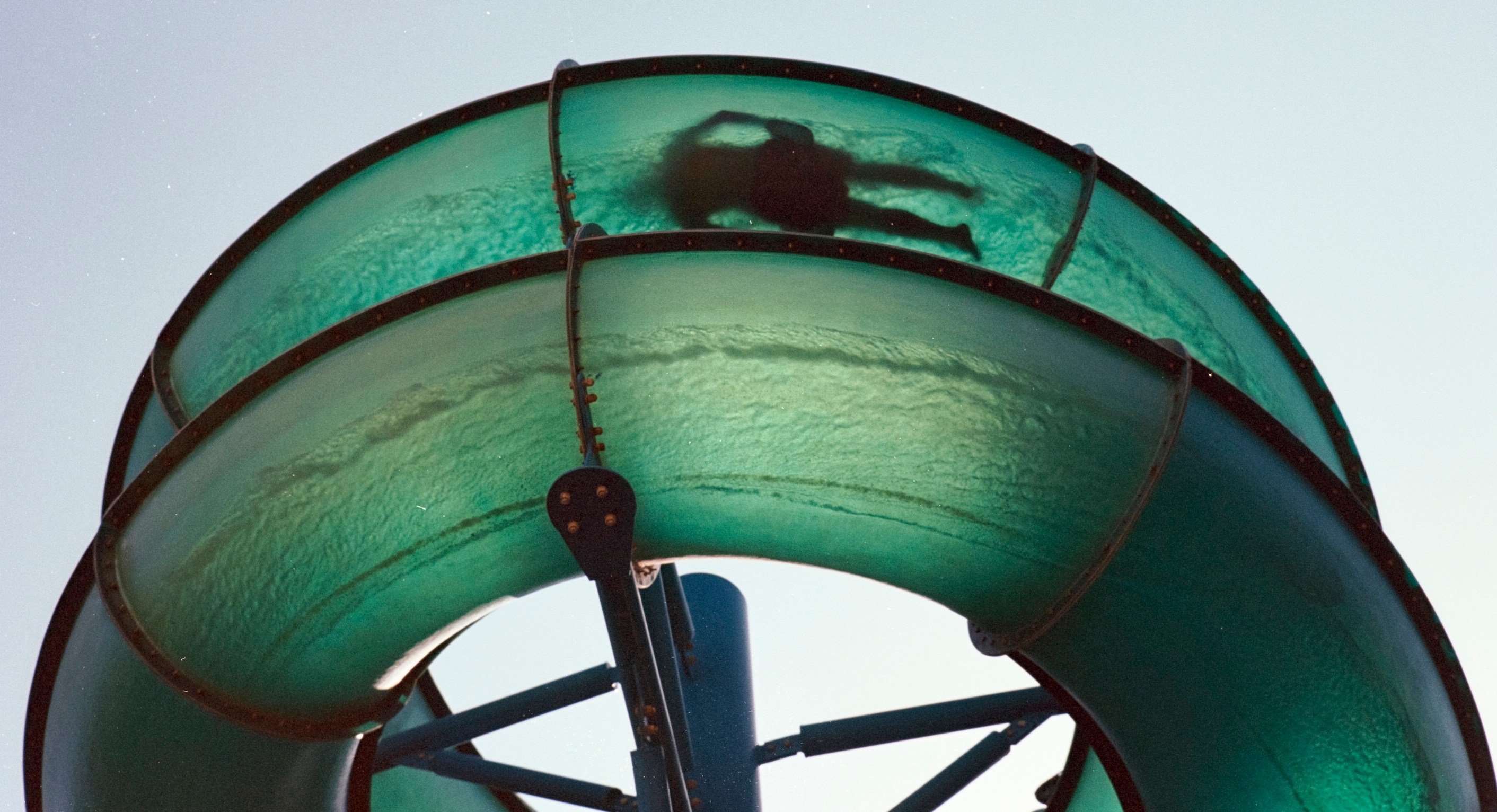 Waterslide person silhoutted shot on 35mm film vintage style