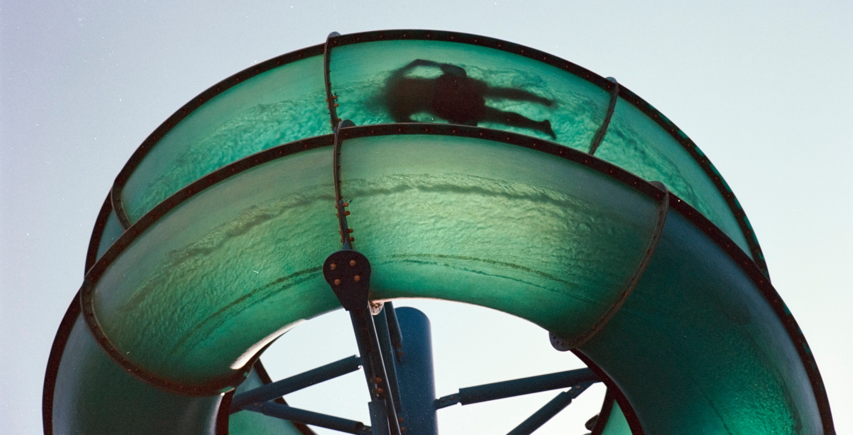 Waterslide person silhoutted shot on 35mm film vintage style