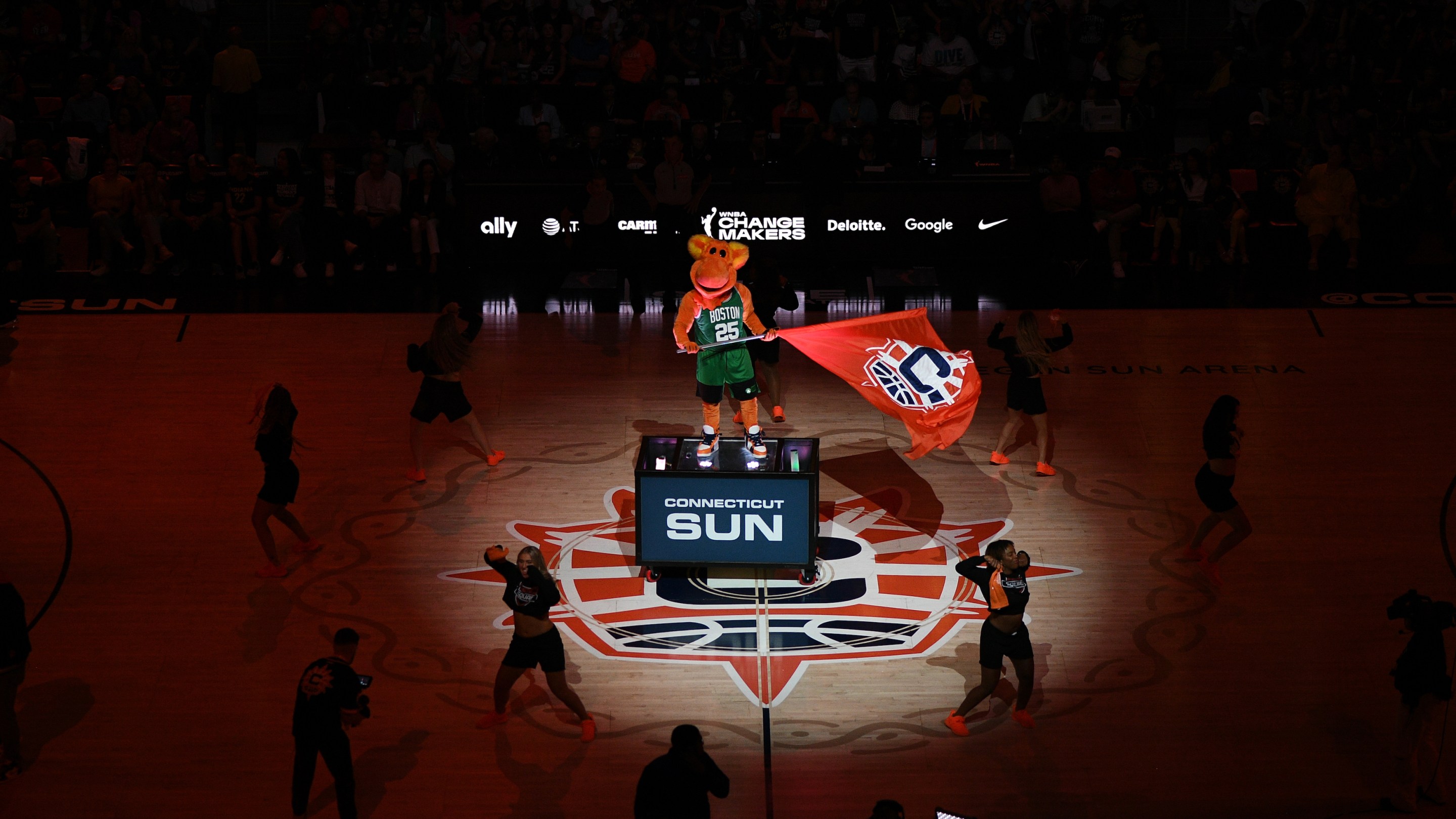 Blaze, the Connecticut Sun mascot, waves a flag during starting lineup introductions before a WNBA game between the Indiana Fever and the Connecticut Sun at TD Garden