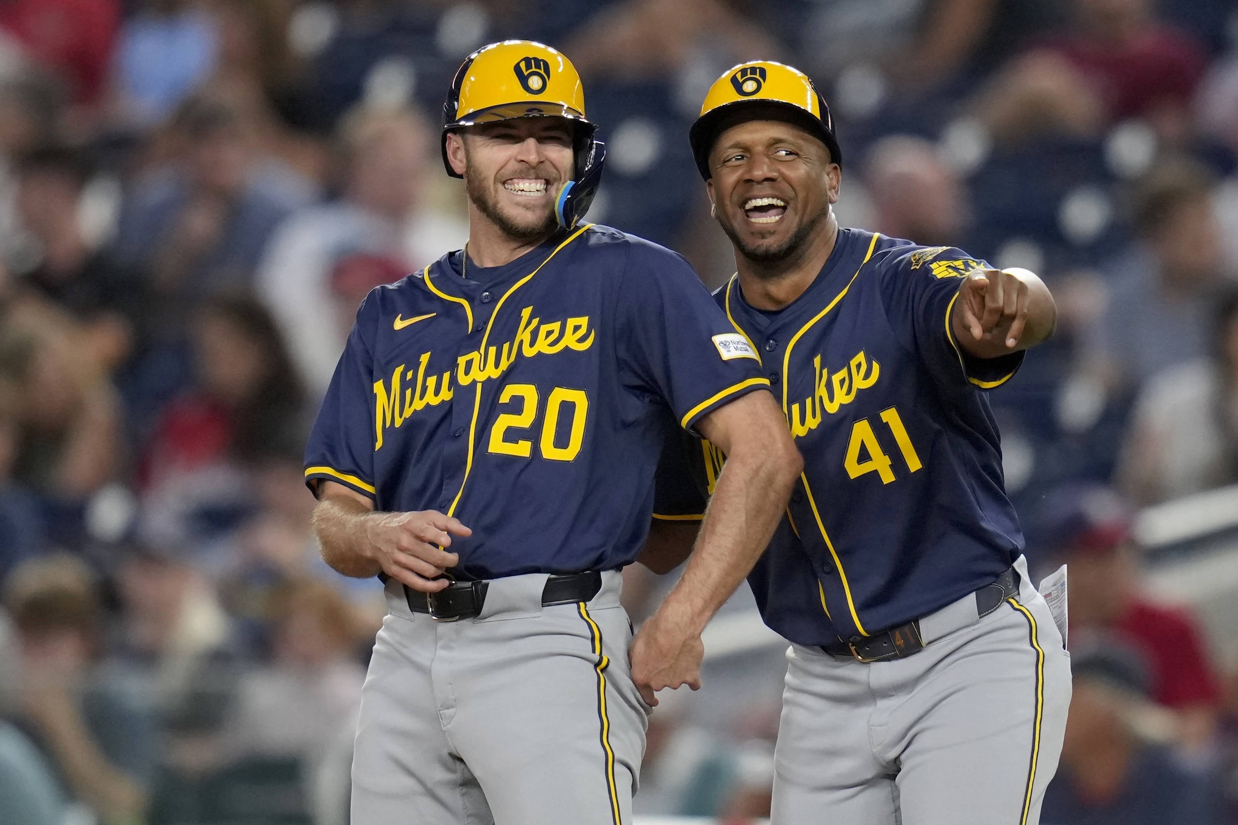 Brandon Lockridge and Julio Borbon of the Brewers laugh together.