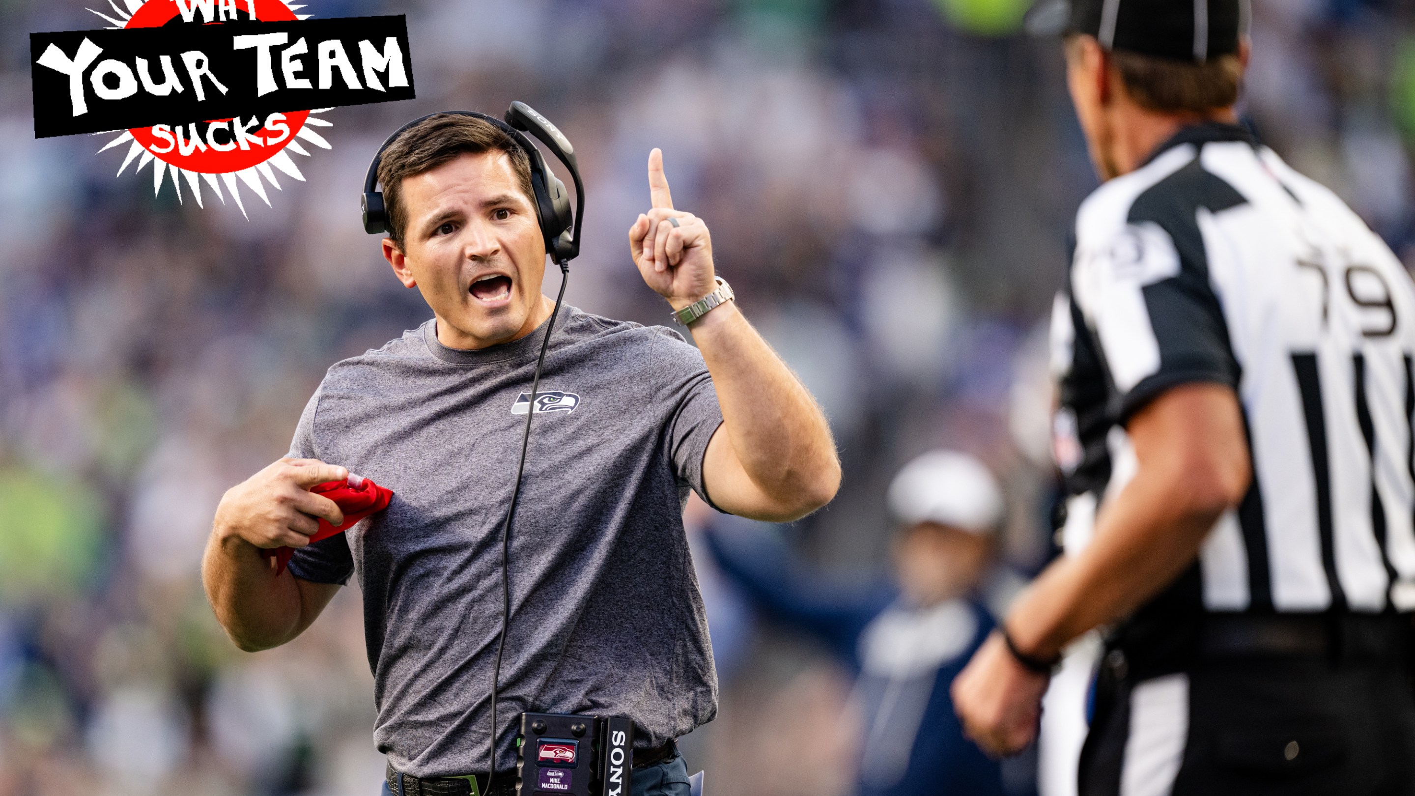 Head Coach Mike Macdonald of the Seattle Seahawks challenges the referee during the first quarter of a game