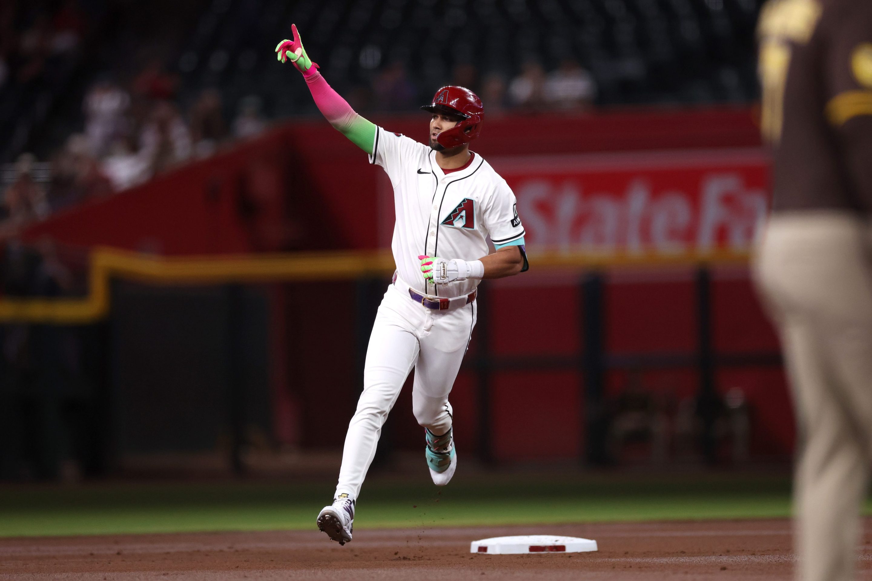 Lourdes Gurriel Jr. #12 of the Arizona Diamondbacks celebrates while running the bases after hitting a two run home run
