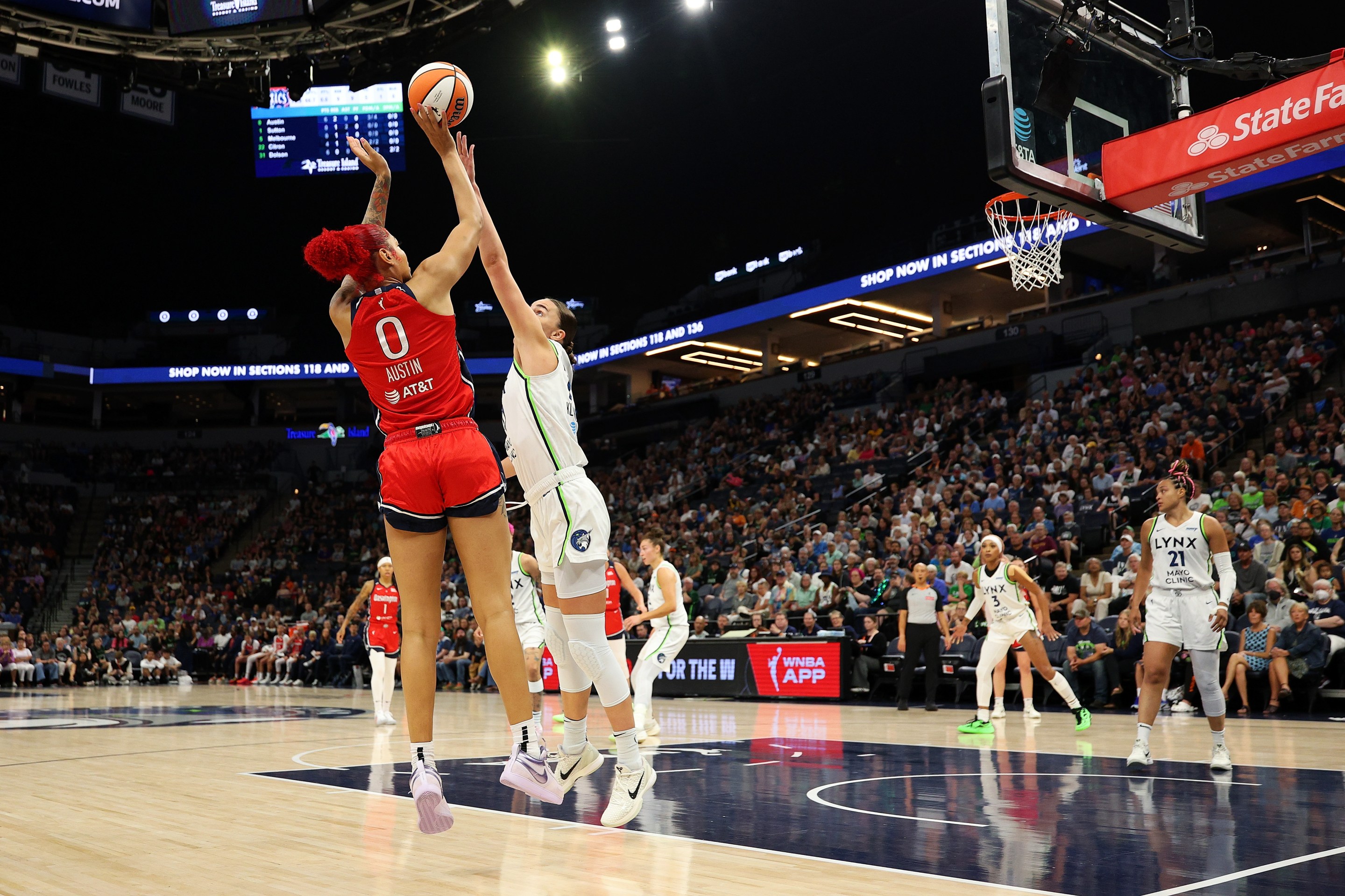 Shakira Austin #0 of the Washington Mystics shoots the ball against Maria Kliundikova #77 of the Minnesota Lynx in the first quarter at Target Center on August 08, 2025 in Minneapolis, Minnesota.