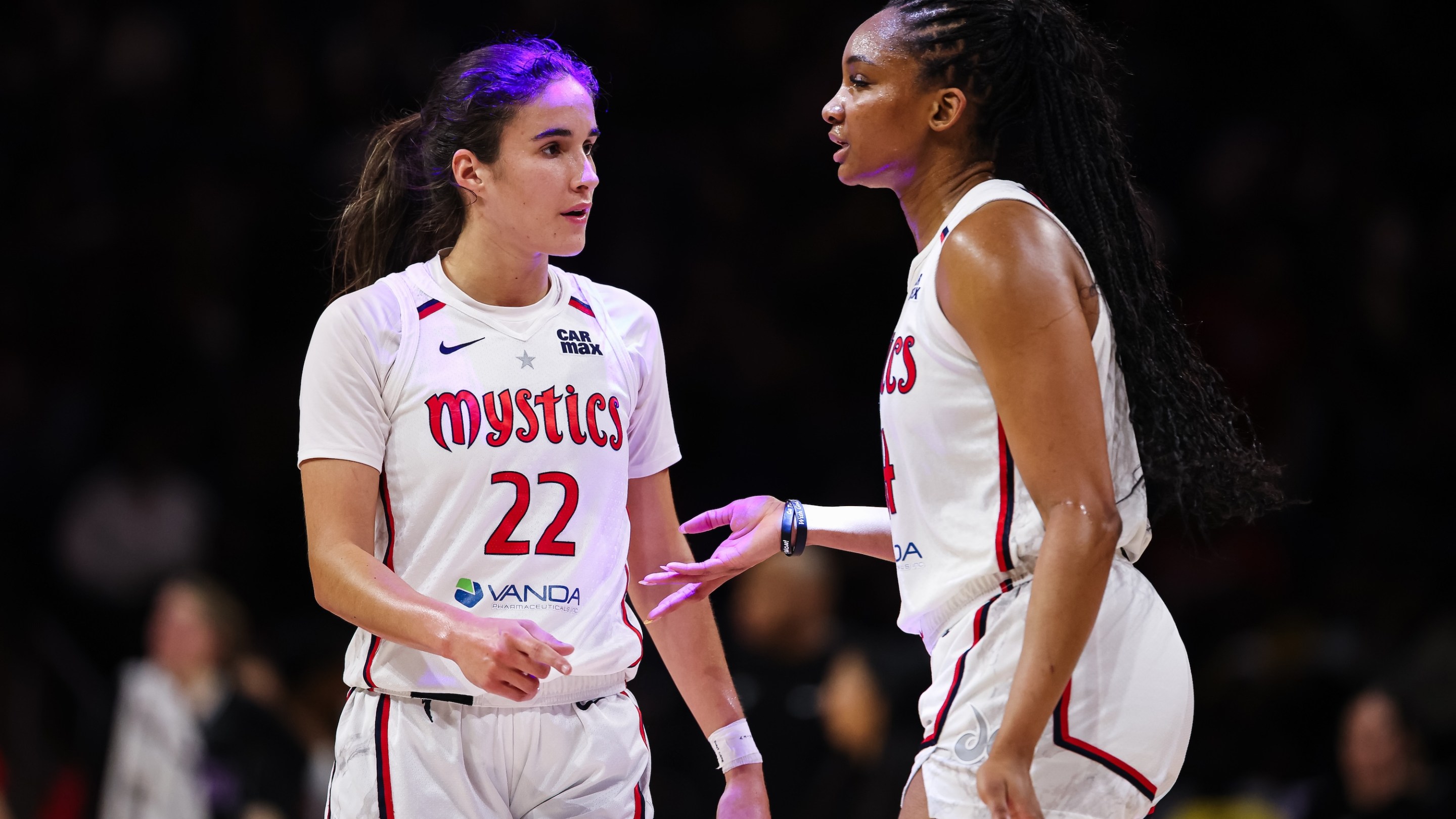 Sonia Citron #22 and Kiki Iriafen #44 of the Washington Mystics interact during the first half of the game against the Golden State Valkyries at CareFirst Arena on July 31, 2025 in Washington, DC.