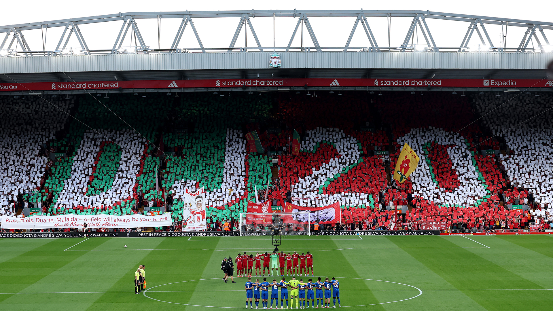 Players, match officials and fans take part in a minute's silence as a fan mosaic depicting "DJ20" is displayed in memory of Diogo Jota and his brother Andre Silva prior to the Premier League match between Liverpool and Bournemouth at Anfield on August 15, 2025 in Liverpool, England