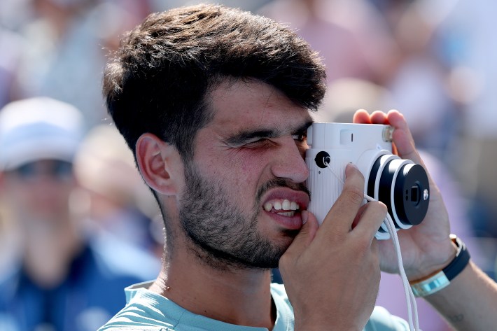 MASON, OHIO - AUGUST 18: Carlos Alcaraz of Spain takes a picture of his team after his win over Jannik Sinner of Italy during the men's final of the Cincinnati Open at Lindner Family Tennis Center on August 18, 2025 in Mason, Ohio.