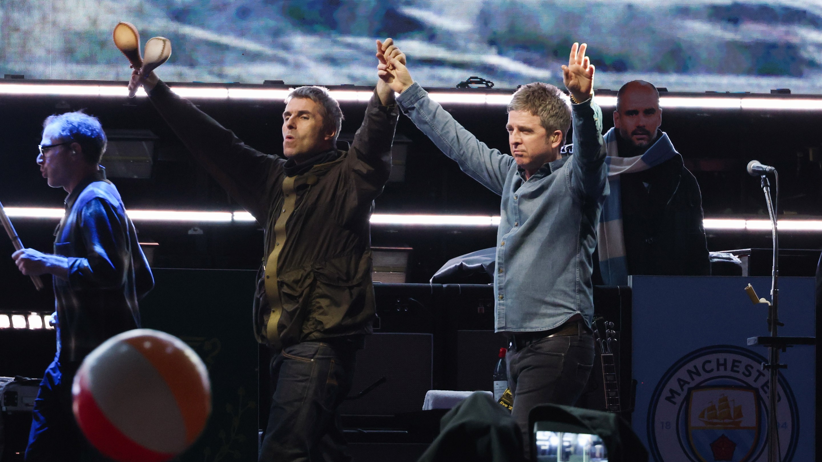 Liam Gallagher and Noel Gallagher perform onstage at the Oasis Live '25 - Toronto concert at Rogers Stadium