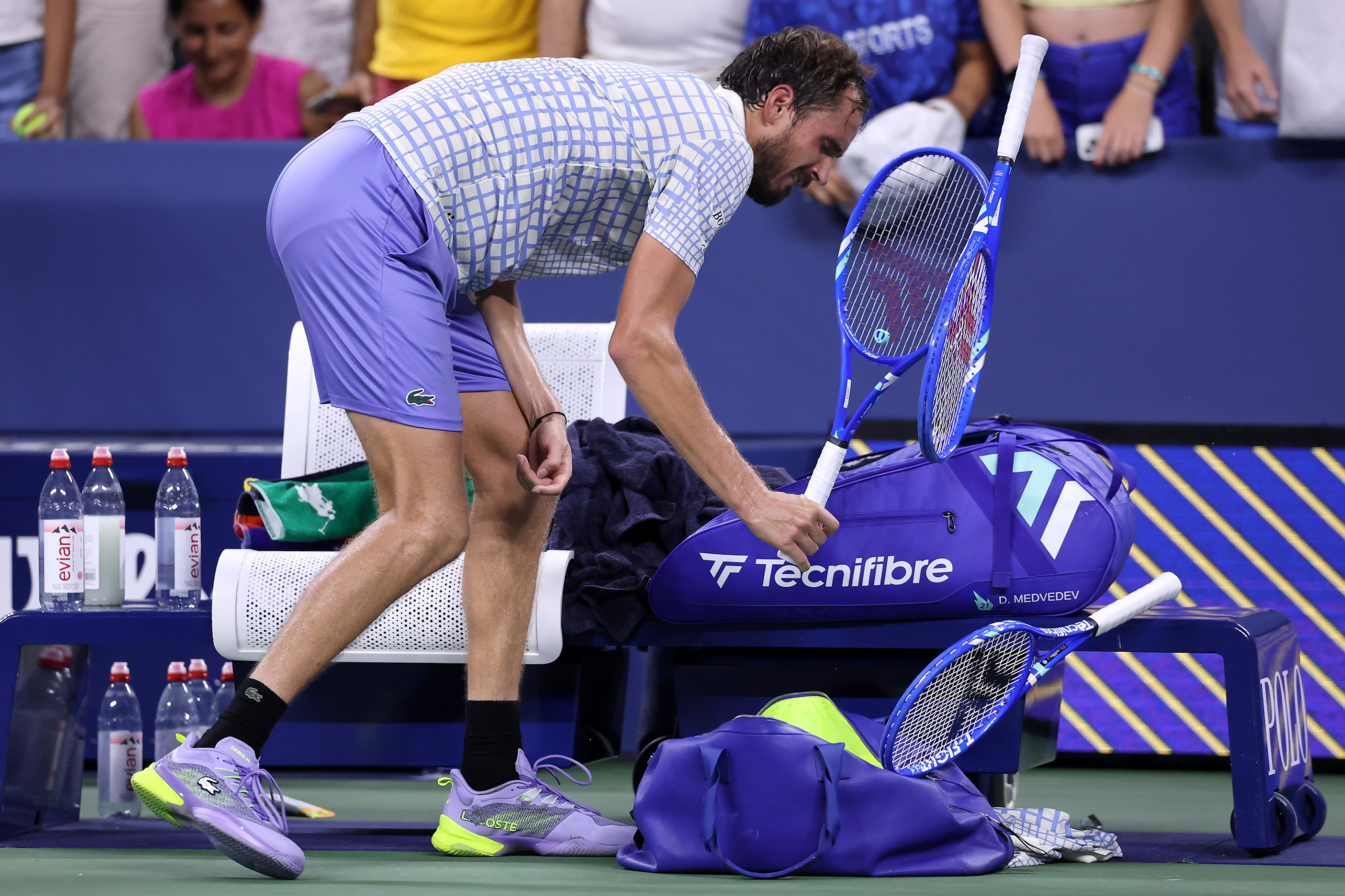 NEW YORK, NEW YORK - AUGUST 24: Daniil Medvedev breaks his racket after losing in five sets to Benjamin Bonzi of France during their Men's Singles First Round match on Day One of the 2025 US Open at USTA Billie Jean King National Tennis Center on August 24, 2025 in the Flushing neighborhood of the Queens borough of New York City. (Photo by Elsa/Getty Images)
