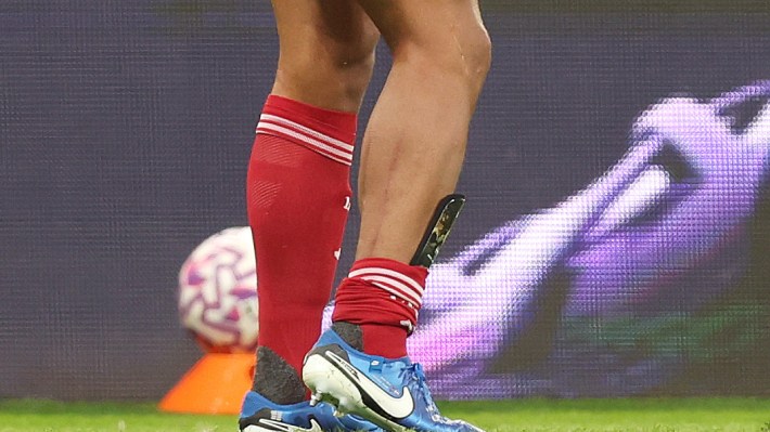 A detailed view of the leg of Virgil van Dijk of Liverpool after being fouled by Anthony Gordon of Newcastle United (not pictured), which results in a red card following a VAR review to upgrade to the initial yellow card during the Premier League match between Newcastle United and Liverpool at St James' Park on August 25, 2025 in Newcastle upon Tyne, England
