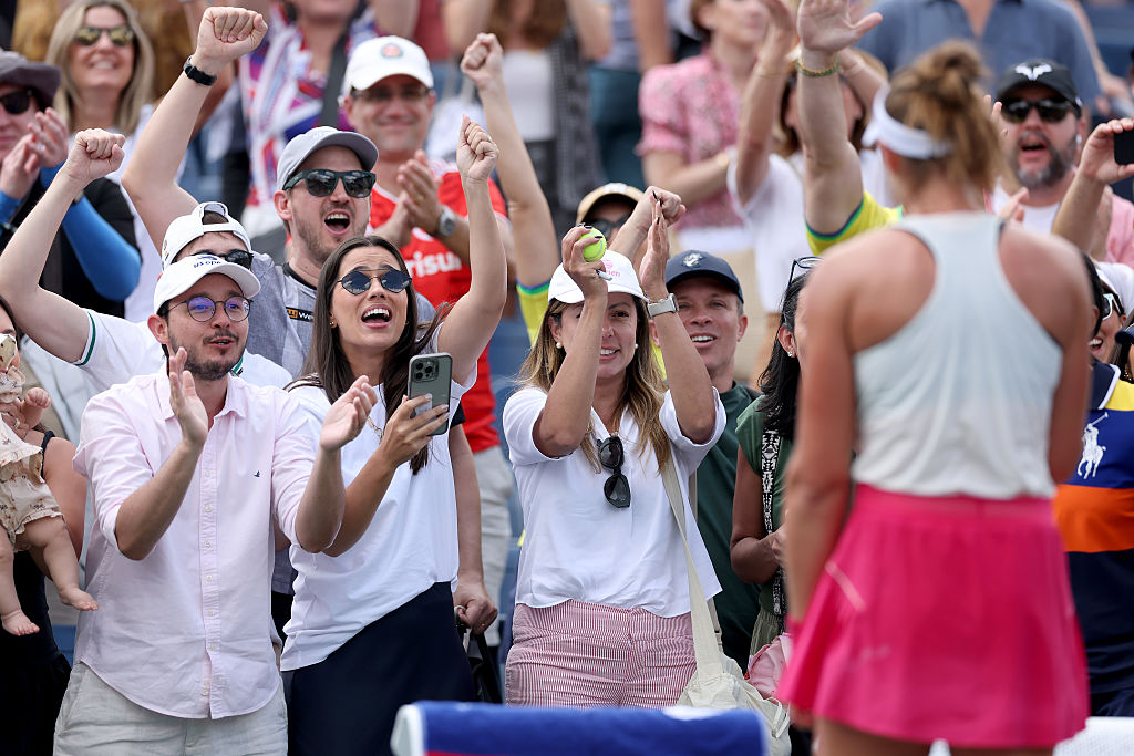 Fans celebrate after Beatriz Haddad Maia of Brazil defeated Viktorija Golubic of Switzerland during their Women's Singles Second Round match on Day Five of the 2025 US Open at USTA Billie Jean King National Tennis Center on August 28, 2025 in the Flushing neighborhood of the Queens borough of New York City.