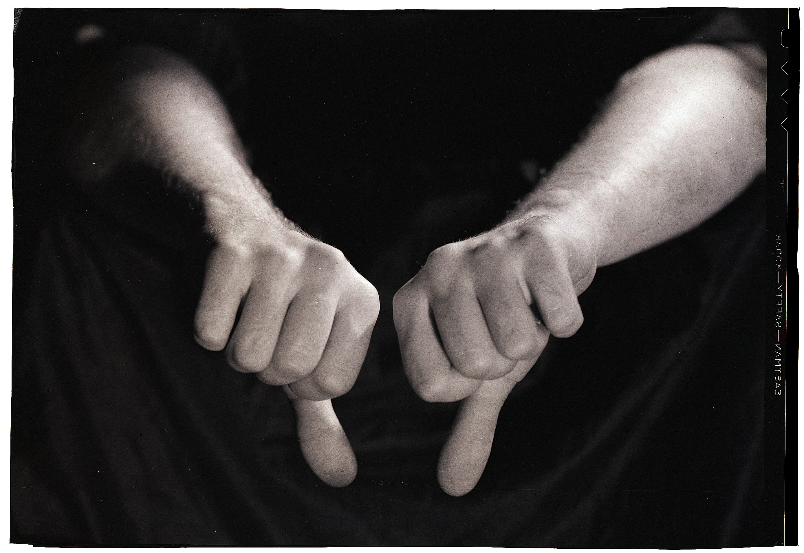 Two thumbs pointing down