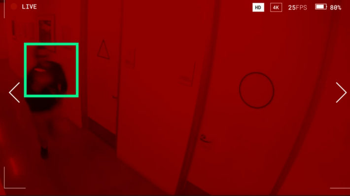 Ice Cube runs down a hallway.