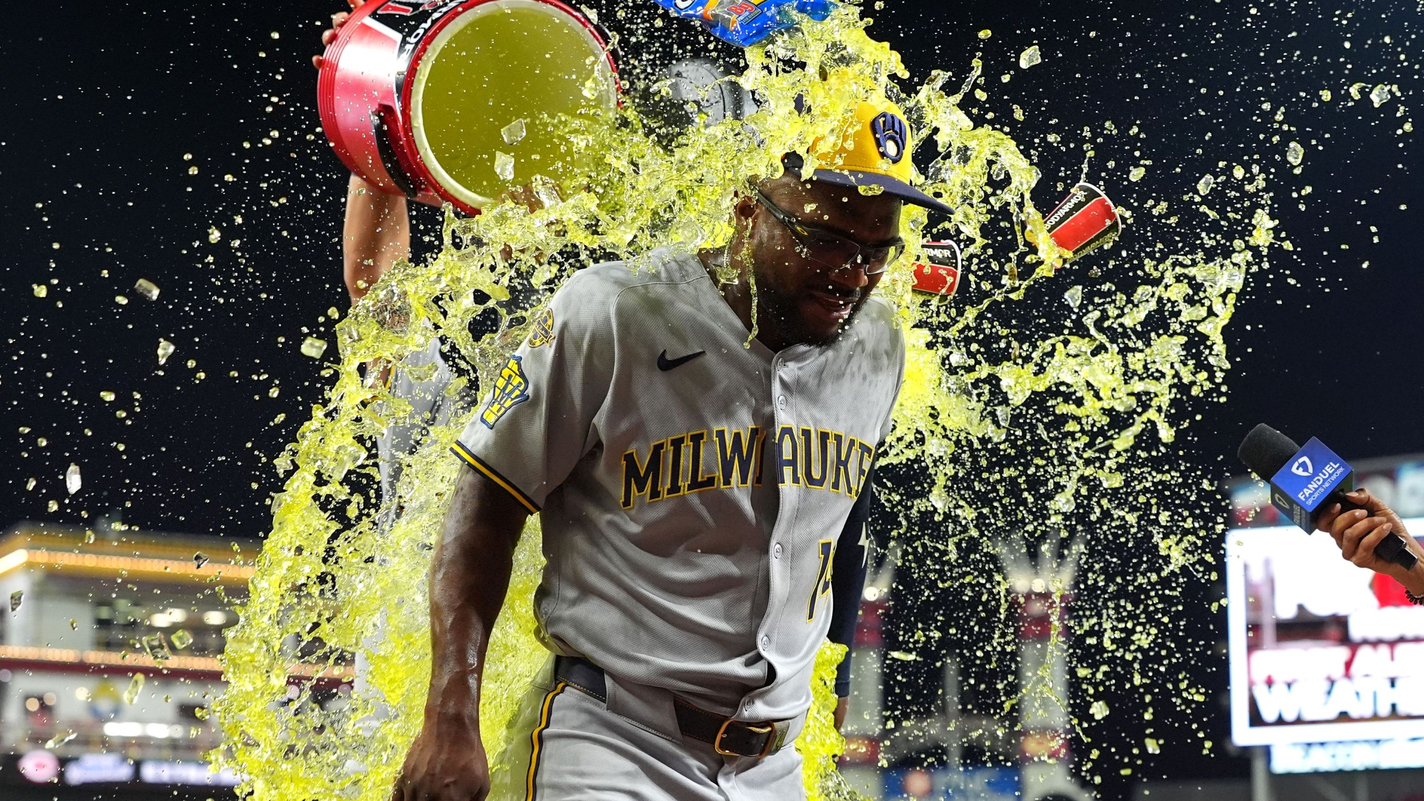 Andruw Monasterio #14 of the Milwaukee Brewers doused with liquid after the game against the Cincinnati Reds.