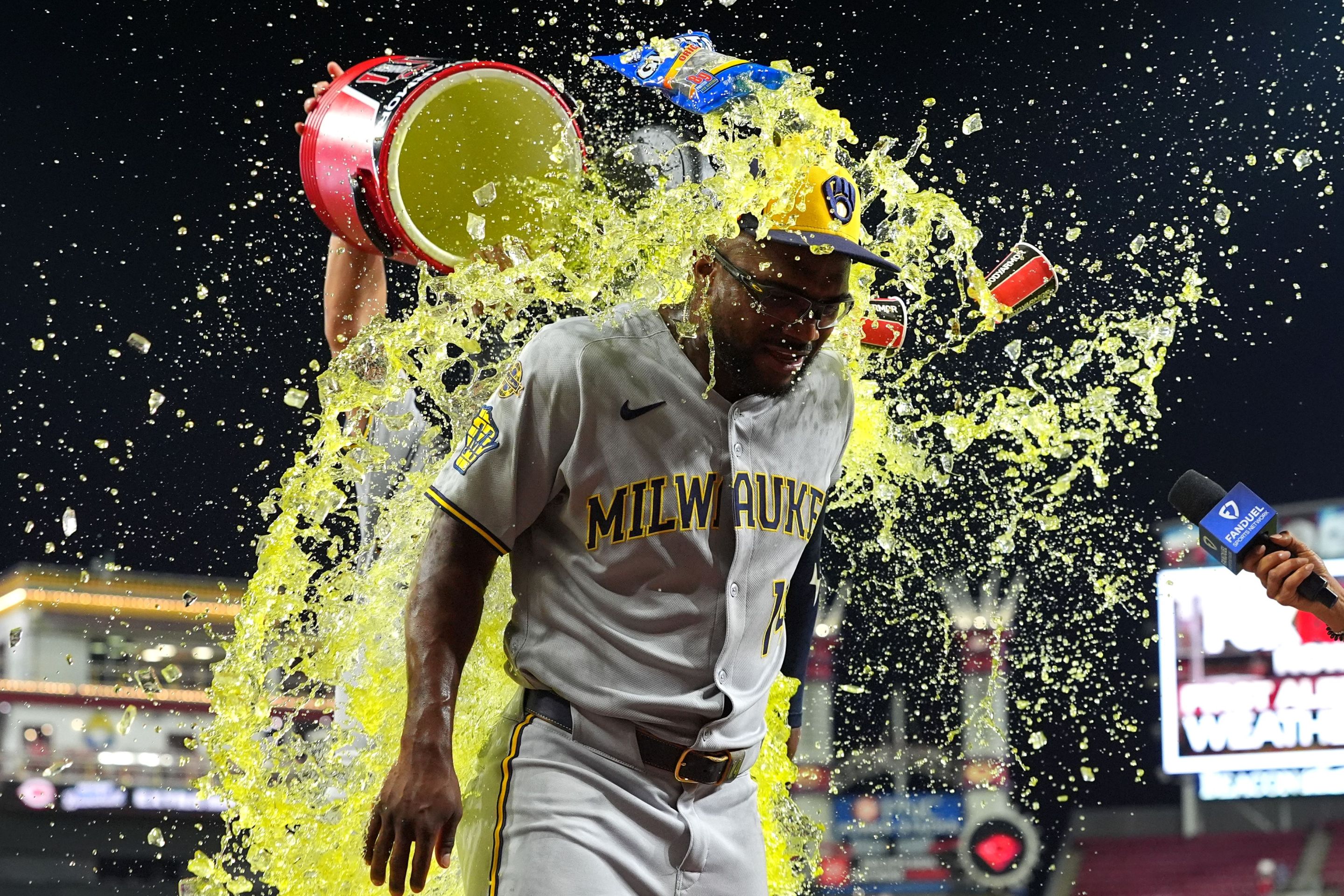 Andruw Monasterio #14 of the Milwaukee Brewers doused with liquid after the game against the Cincinnati Reds.