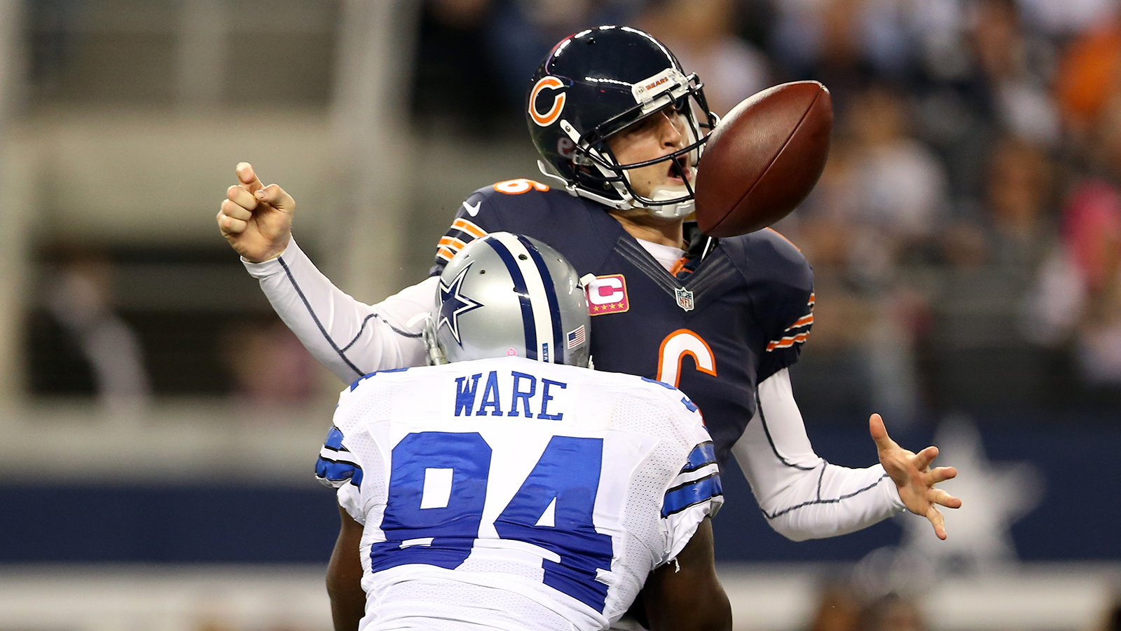 ARLINGTON, TX - OCTOBER 01: Jay Cutler #6 of the Chicago Bears fumbles the ball as he is sacked by DeMarcus Ware #94 of the Dallas Cowboys in the third quarter at Cowboys Stadium on October 1, 2012 in Arlington, Texas.
