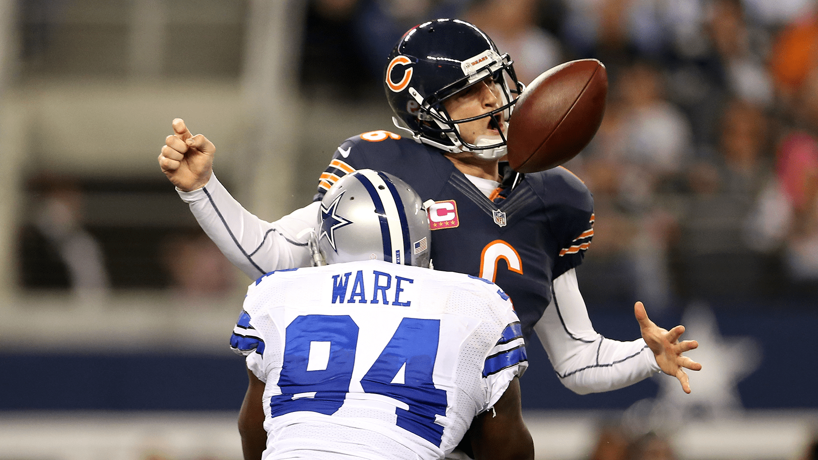 ARLINGTON, TX - OCTOBER 01: Jay Cutler #6 of the Chicago Bears fumbles the ball as he is sacked by DeMarcus Ware #94 of the Dallas Cowboys in the third quarter at Cowboys Stadium on October 1, 2012 in Arlington, Texas.