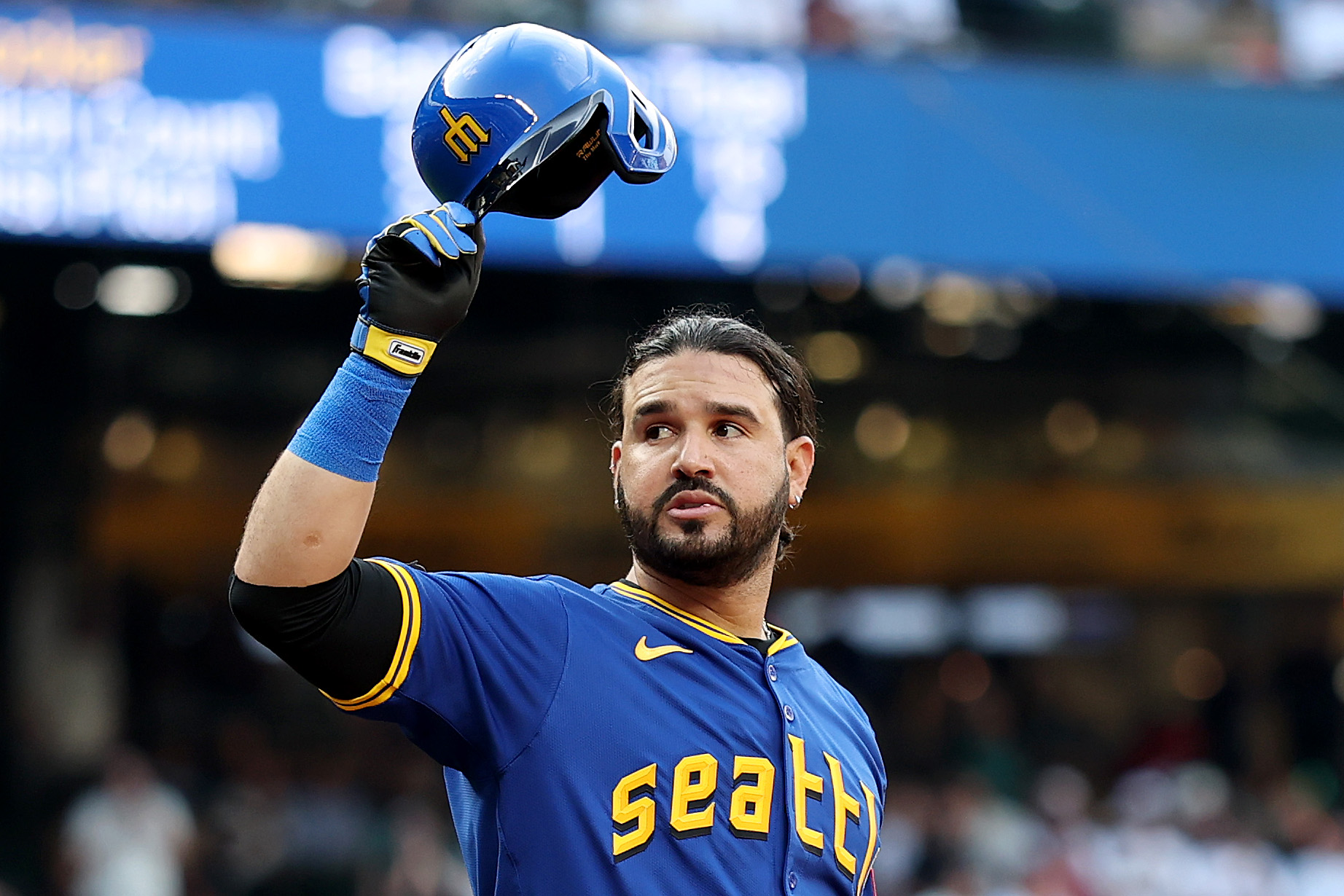 Eugenio Suárez #28 of the Seattle Mariners tips his cap during his first at bat back with the Mariners.