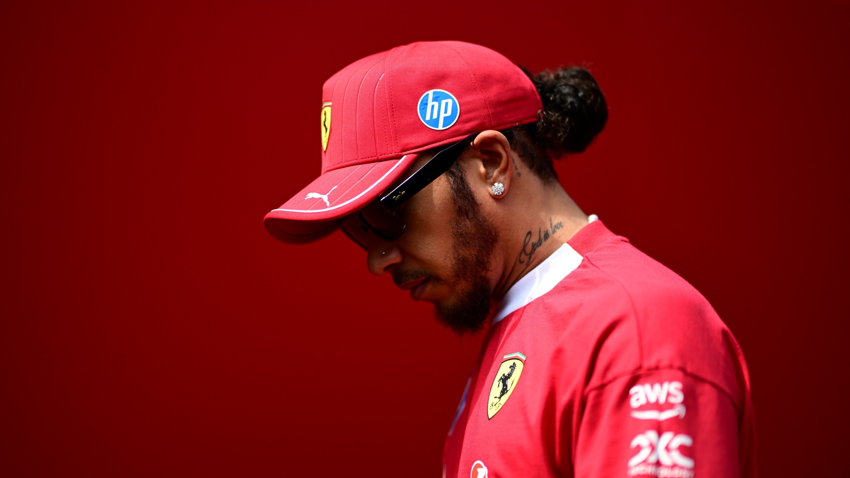 Lewis Hamilton of Scuderia Ferrari walks in the paddock during free practice of the Hungarian GP.