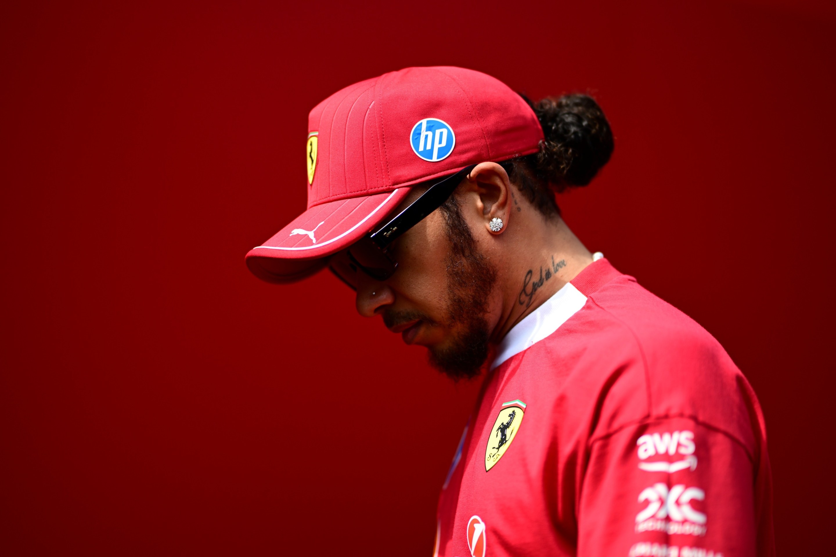 Lewis Hamilton of Scuderia Ferrari walks in the paddock during free practice of the Hungarian GP.
