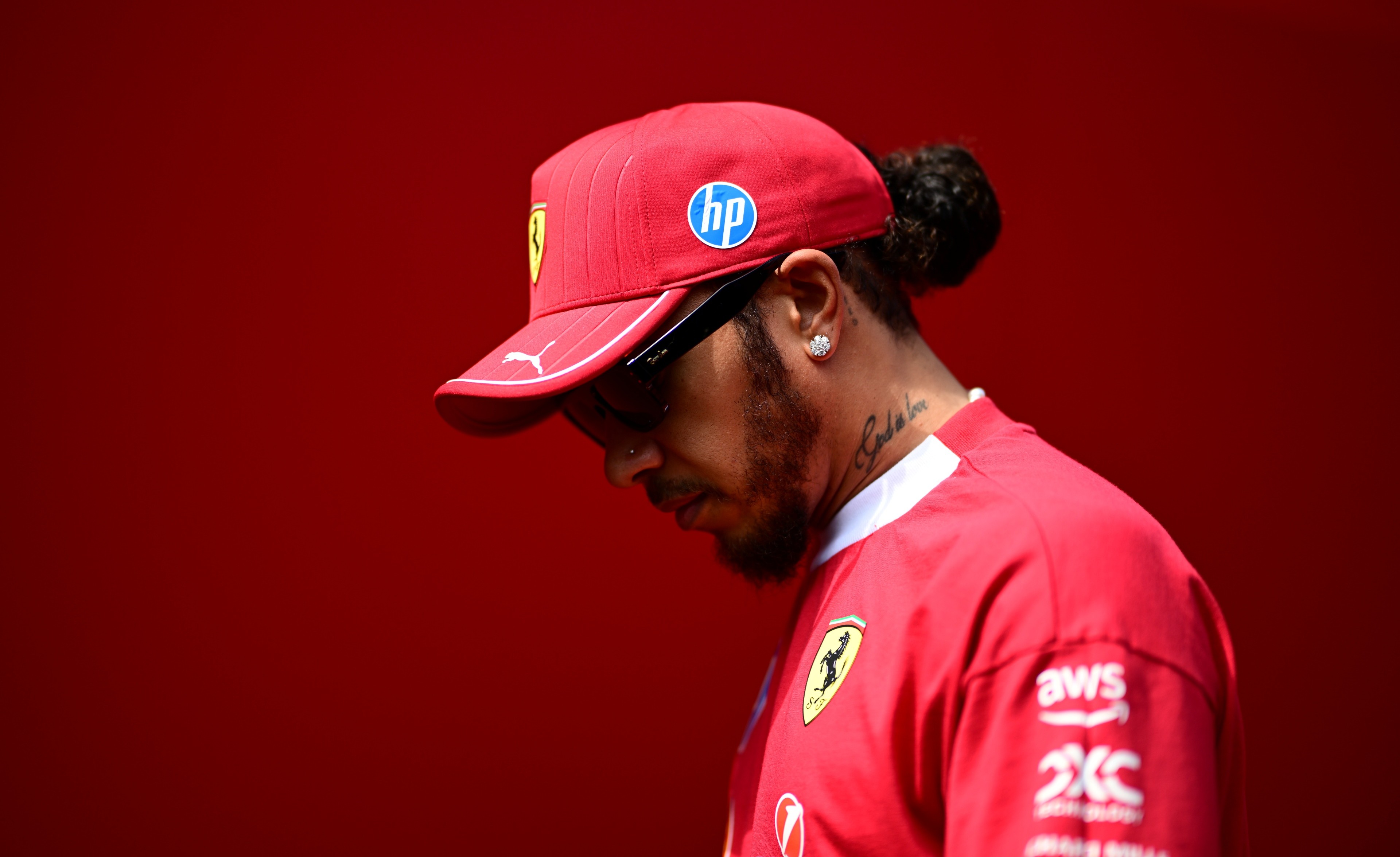 Lewis Hamilton of Scuderia Ferrari walks in the paddock during free practice of the Hungarian GP.