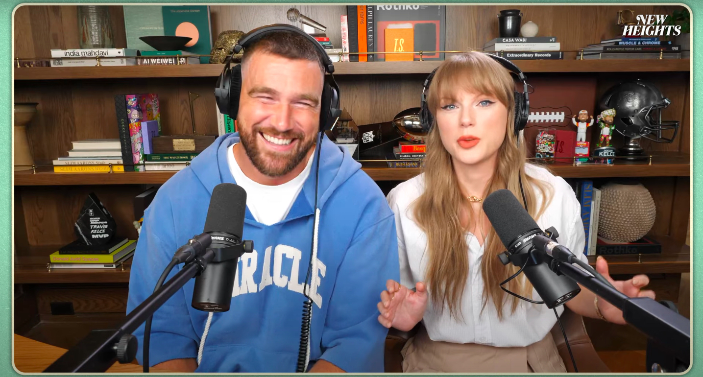 Travis Kelce and Taylor Swift talk on a podcast.