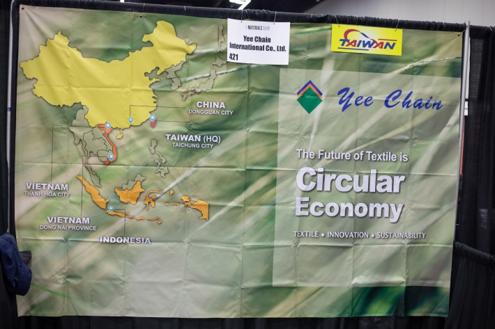 A banner in the Yee Chain International Co. Ltd booth at The Materials Show in Portland, Ore. in February of 2025, detailing their assertion that The Future of Textile is Circular Economy.