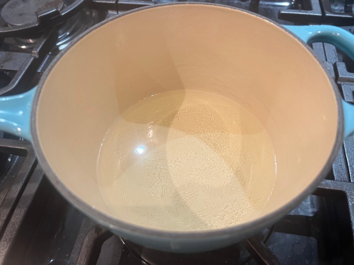 Clear liquid in a saucepan.