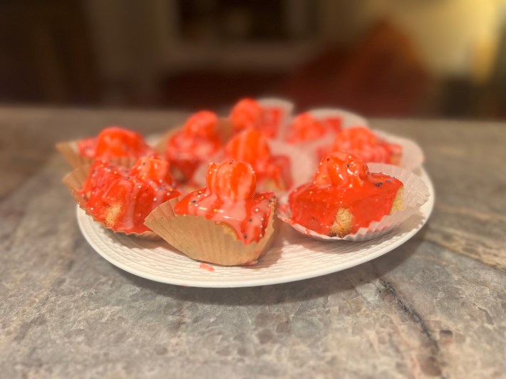 Tacky pink cubes of cake arranged on a plate.