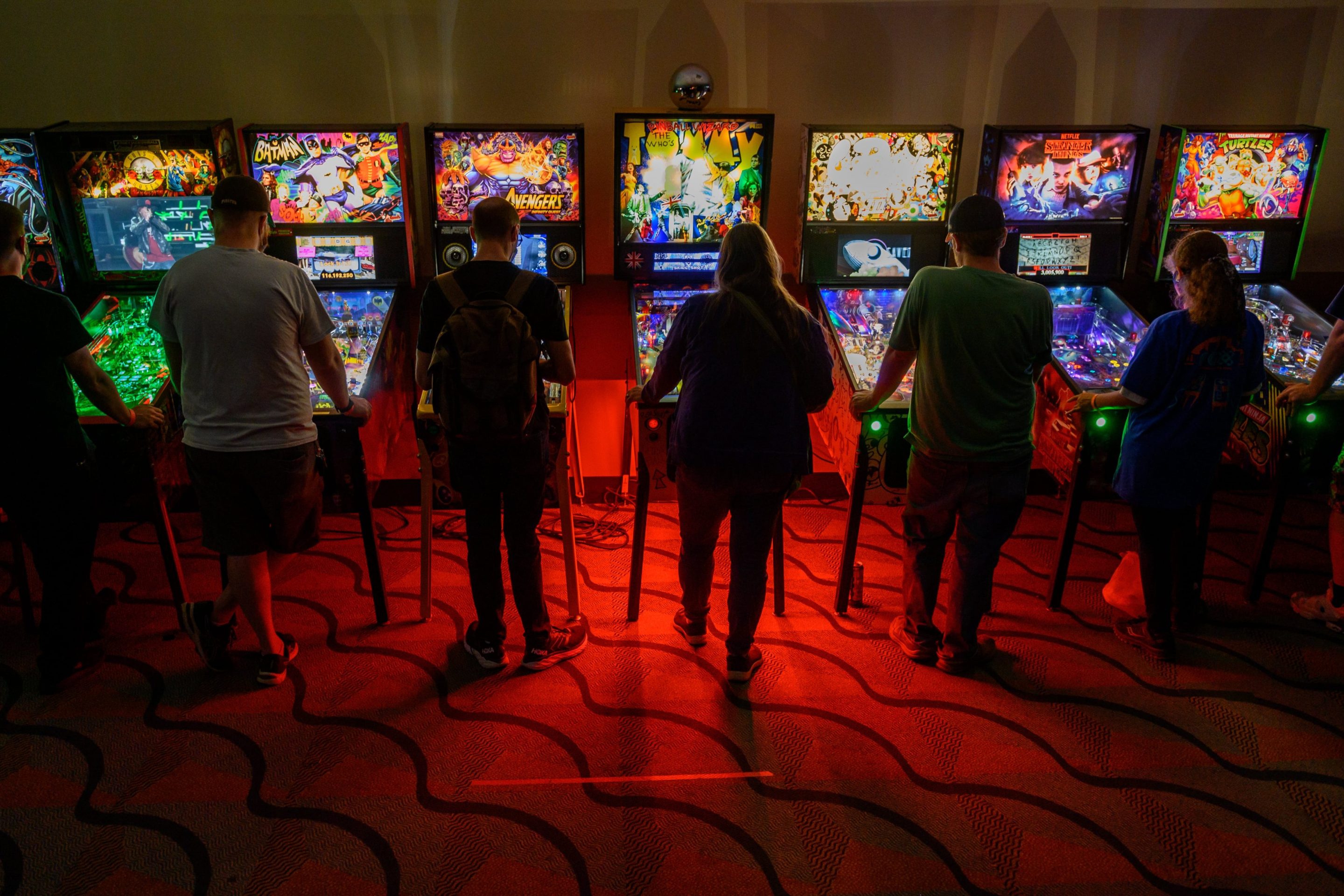 Gamers sample an assortment of pinball machines
