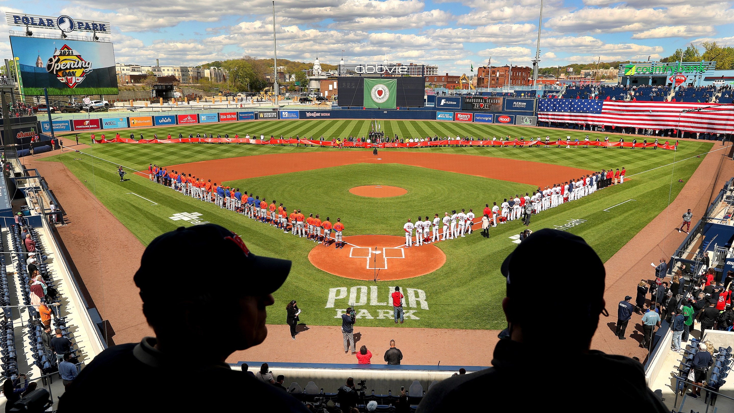 Worcester, MA - May 11: Opening Day at the new Polar Park for the Worcester Red Sox in Worcester on May 11, 2021. Spectators watch from above home plate as Syracuse Mets and the WooSox line the field. (Photo by John Tlumacki/The Boston Globe via Getty Images)