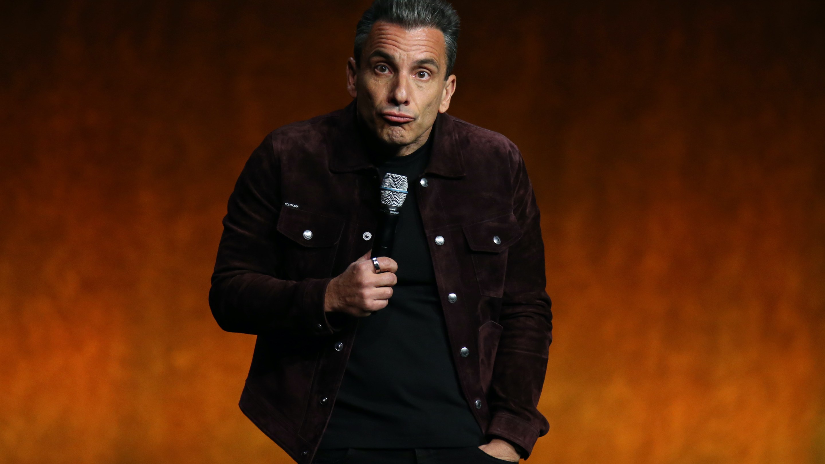 Sebastian Maniscalco performs on stage.
