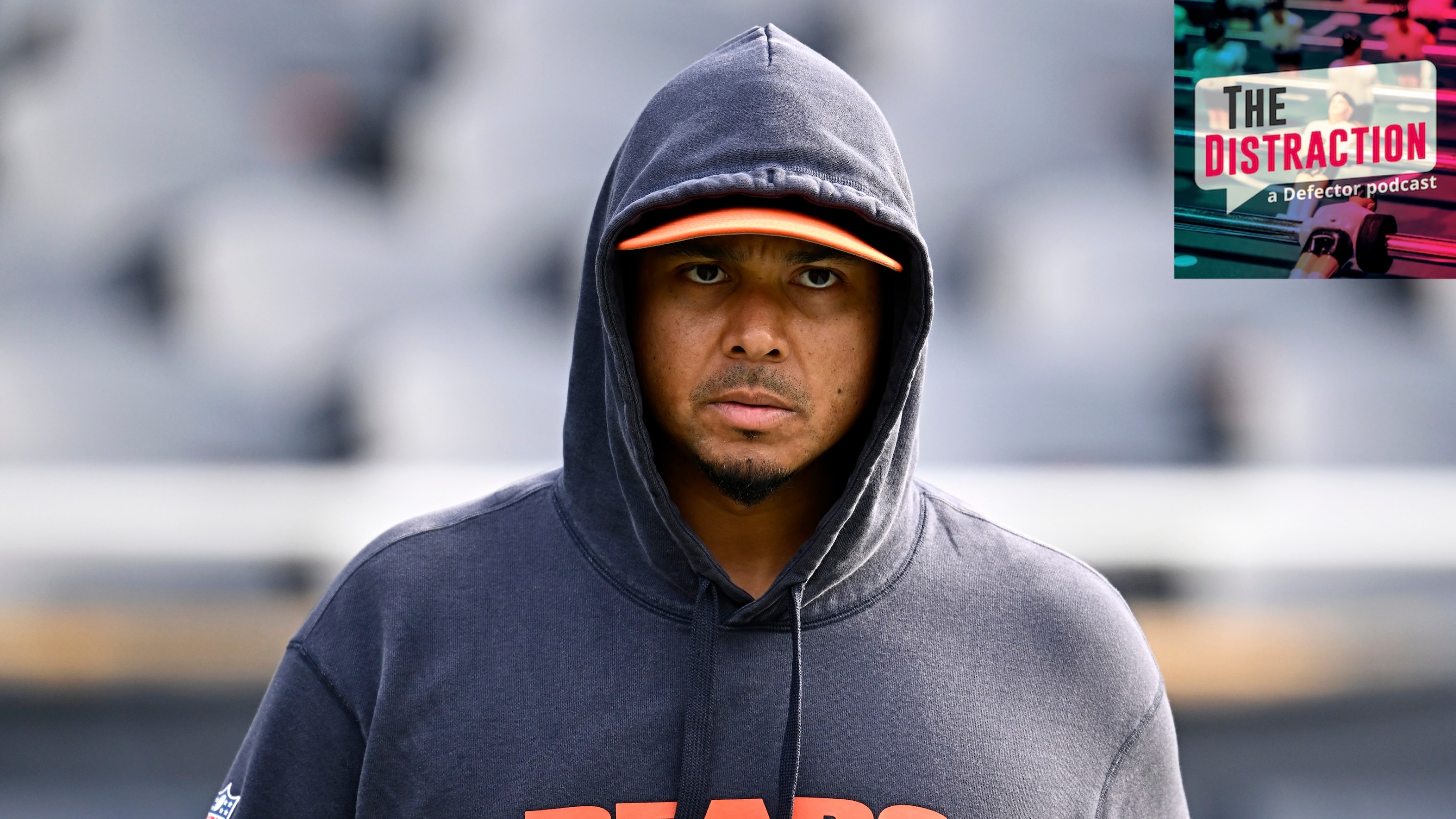 General manager Ryan Poles of the Chicago Bears looks on prior to a game against the Green Bay Packers at Soldier Field on November 17, 2024. He is scowling under a hoodie.
